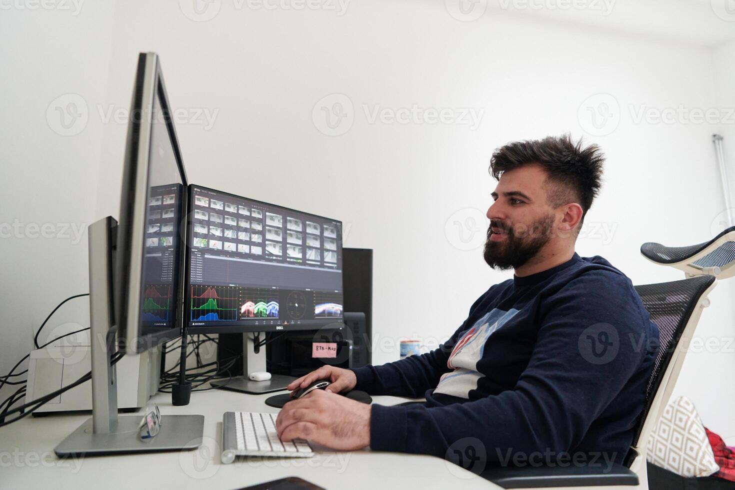 professional editor enhancing digital footage using specialized software photo