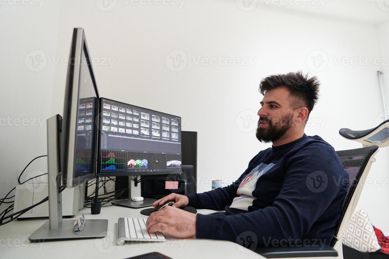 professional editor enhancing digital footage using specialized software photo