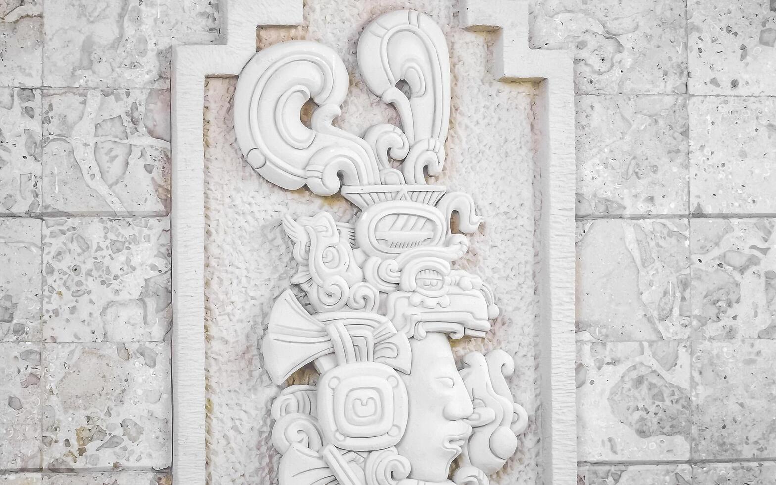 Playa del Carmen Quintana Roo Mexico 2023 Maya sculpture design on wall modern building texture pattern Mexico. photo