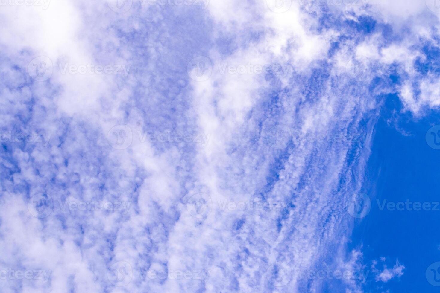 Blue sky with chemical chemtrails cumulus clouds scalar waves sky. photo