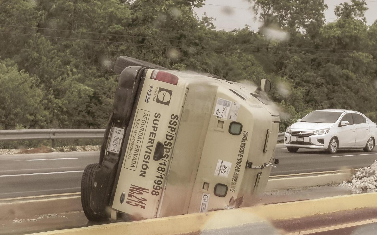 Playa del Carmen Quintana Roo Mexico 2023 Overturned cash transport Road accident on highway in Mexico. photo