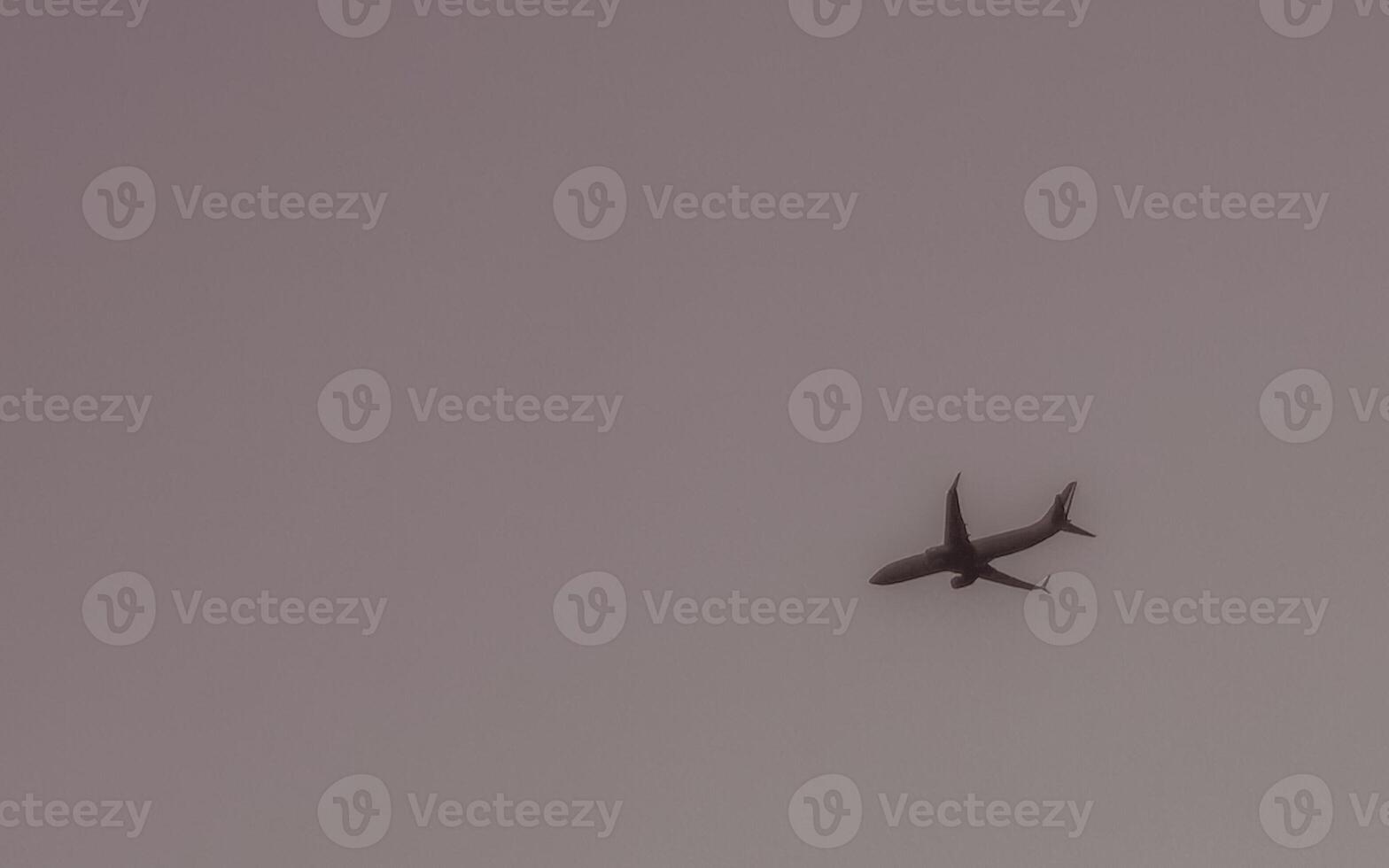 Passenger airplane flies in blue sky with clouds in Mexico. photo