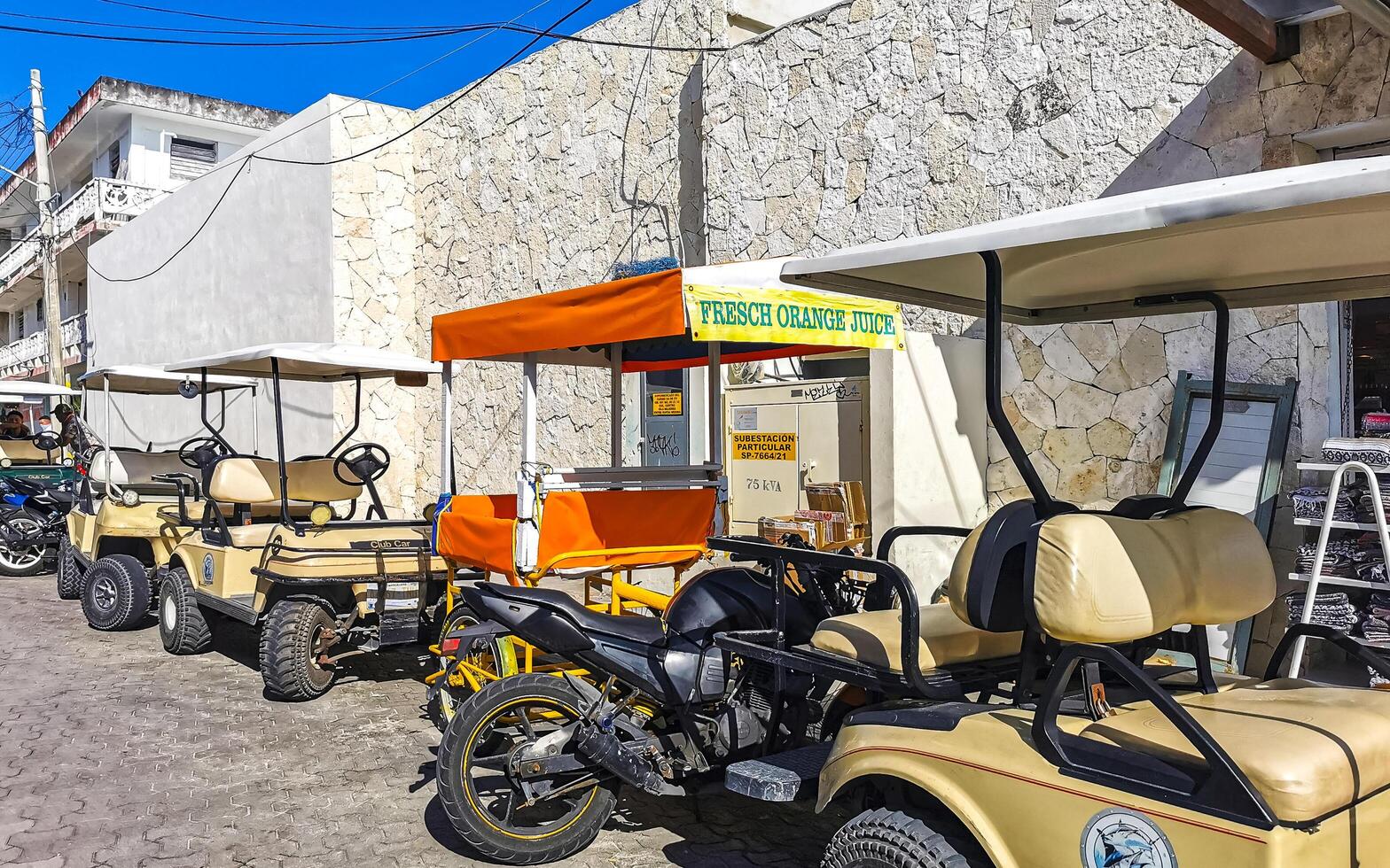 Gold cart rent drive tourist streets sidewalks Isla Mujeres Mexico. photo