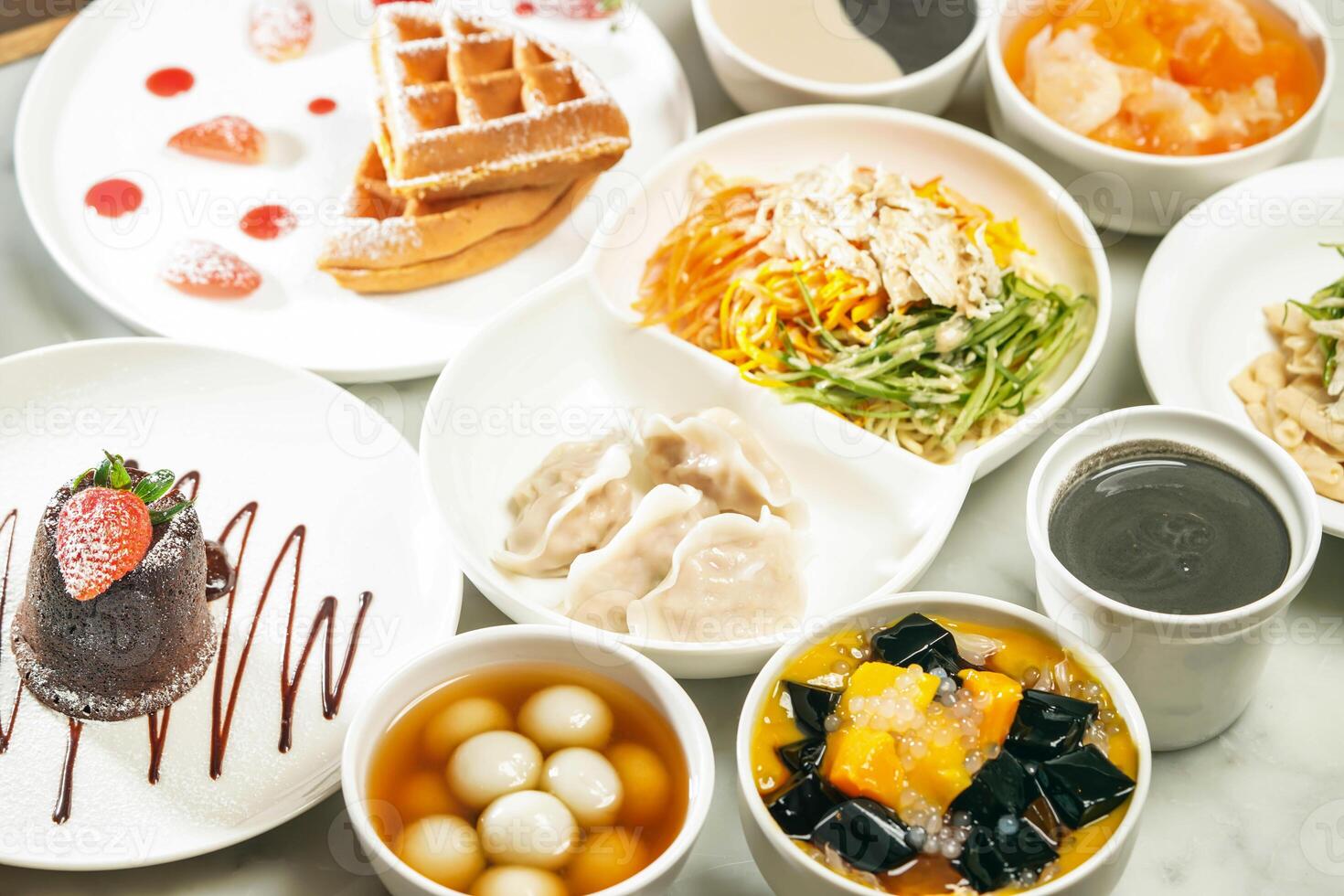 cold noodles, shredded chicken and dumplings Strawberry Souffle Waffles, Molten chocolate lava cake, Ginger sesame soup balls, Mango sago grass Jelly, Stewed Papaya Snow Fungus, Sesame paste photo