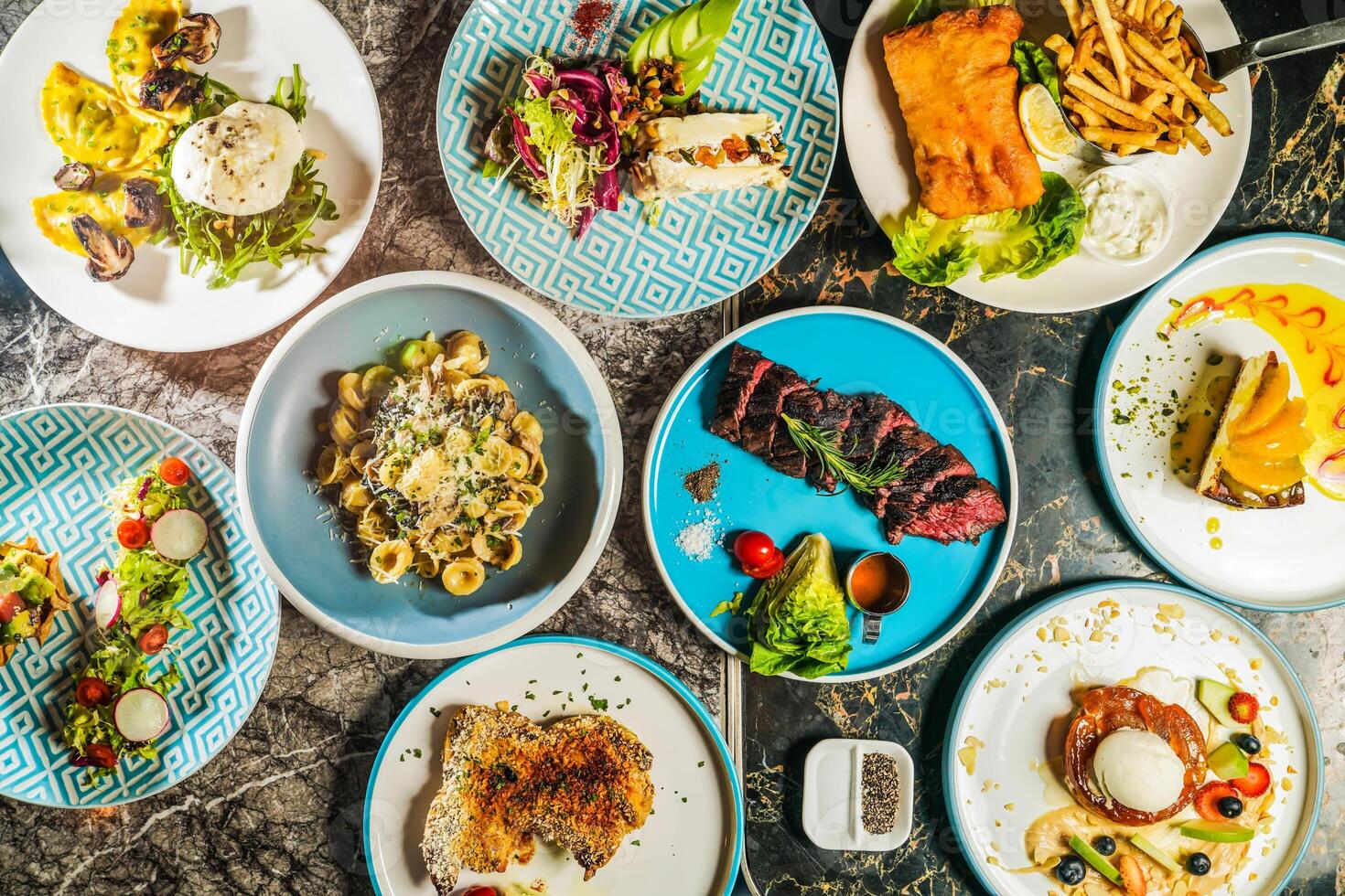 grilled Beef belly steak, Orecchiette Pasta with Spinach, Mushrooms, Porcini wontons with buffalo mozzarella, Fried cod fish and chips, Roasted Spring Chicken, French Apple Batch, New York Cheesecake photo
