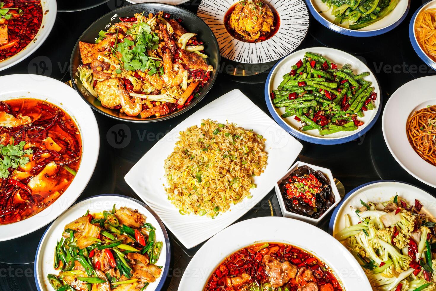 Spicy hot pot, fried rice, fried String Beans with Minced Pork, fungus, Steamed Chicken with Chili Sauce, Mapo Tofu, Bawang Chicken, boiled fish, pork belly, served side view of hong kong food photo