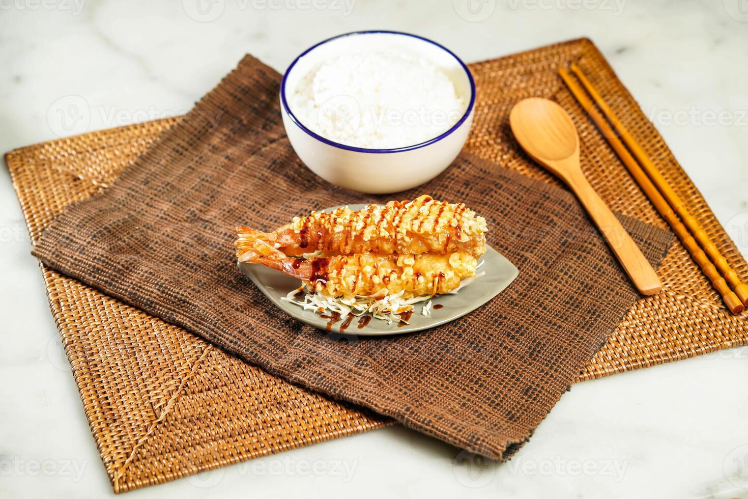 Japanese Deep Fried Shrimp Donburi with Rice, chopsticks and spoon served in bowl isolated on napkin side view of Japanese food photo