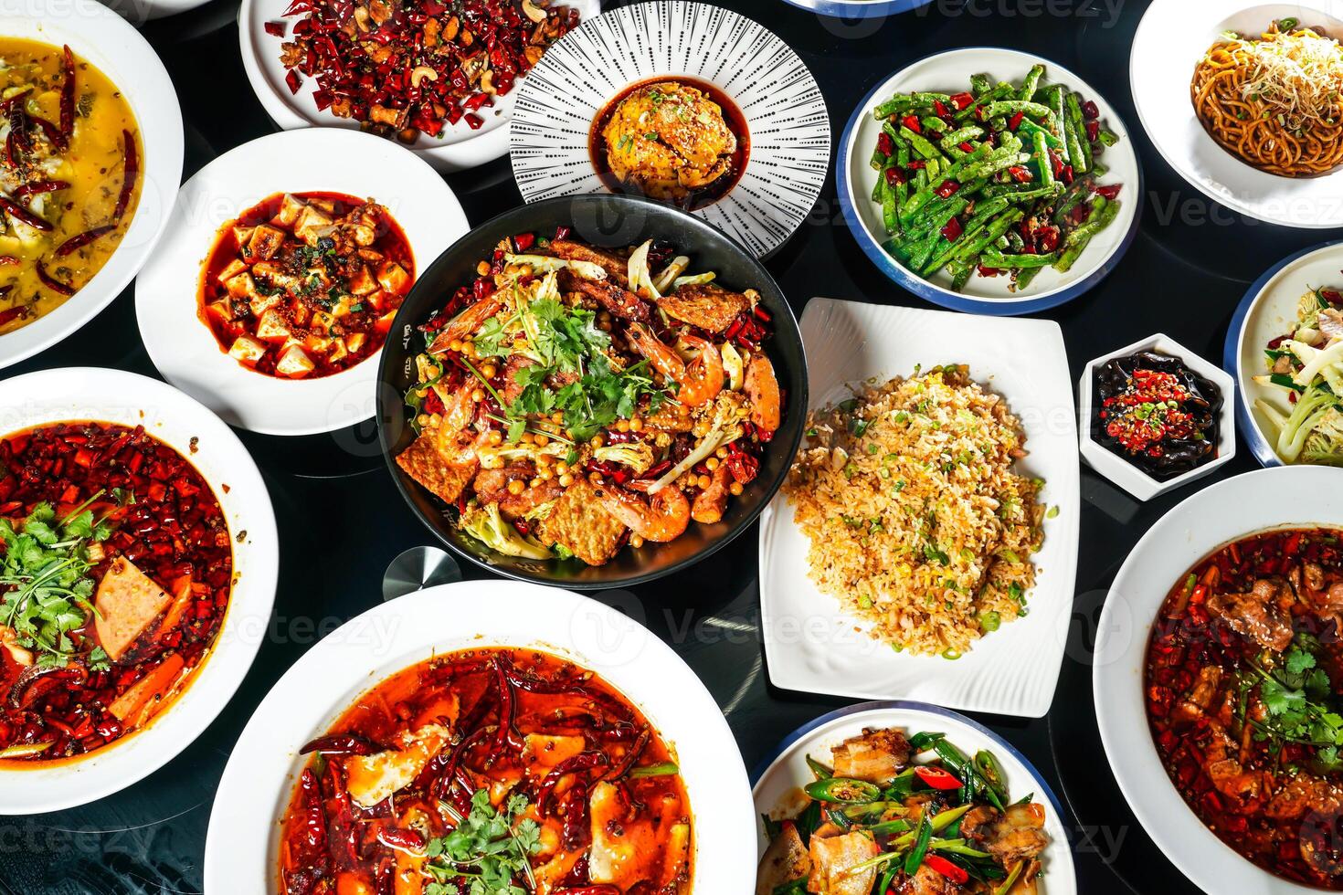 Spicy hot pot, fried rice, fried String Beans with Minced Pork, fungus, Steamed Chicken with Chili Sauce, Mapo Tofu, Bawang Chicken, boiled fish, pork belly, served top view of hong kong food photo