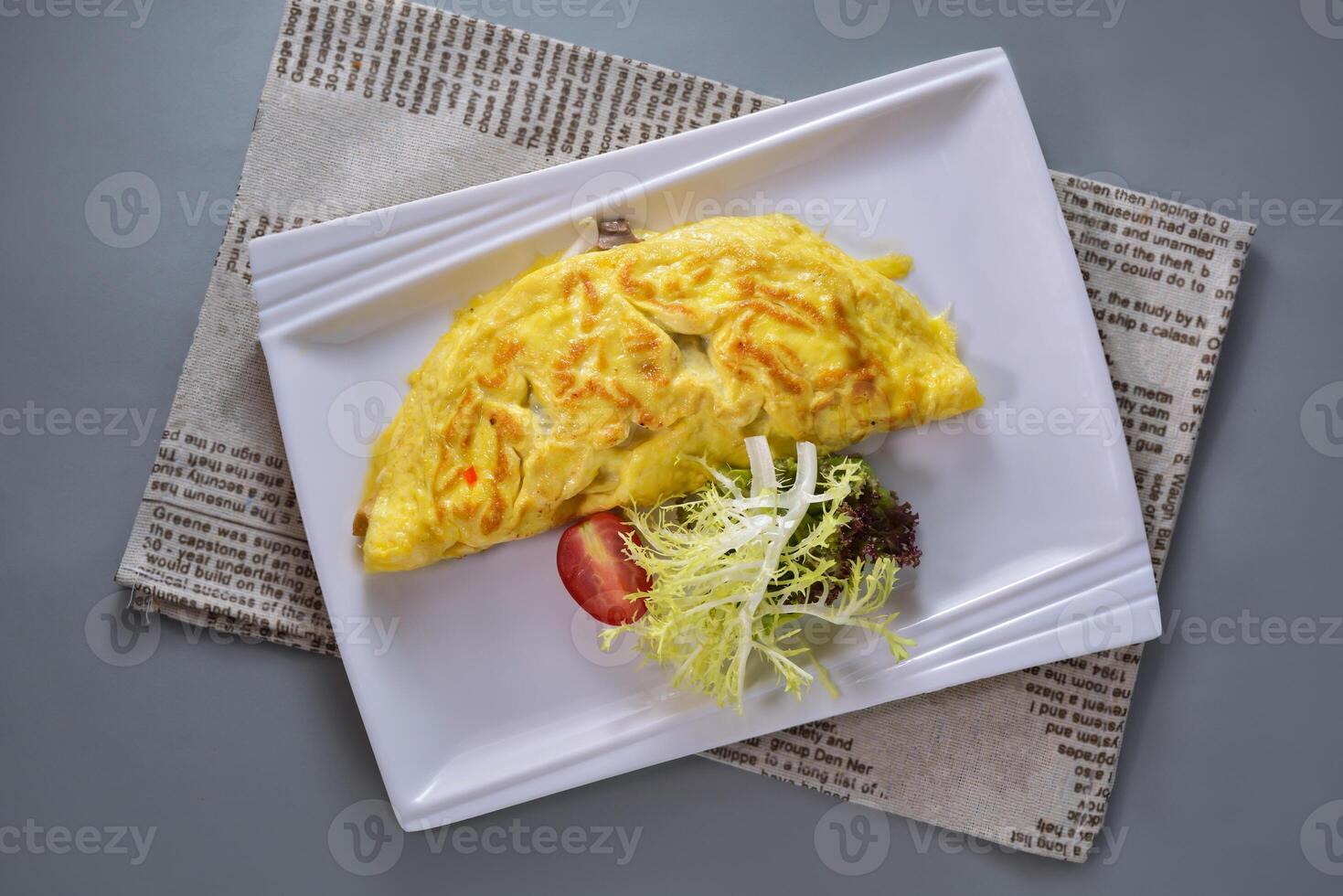 Spanish Omelette breakfast served in dish isolated on napkin top view of chinese food on grey background photo