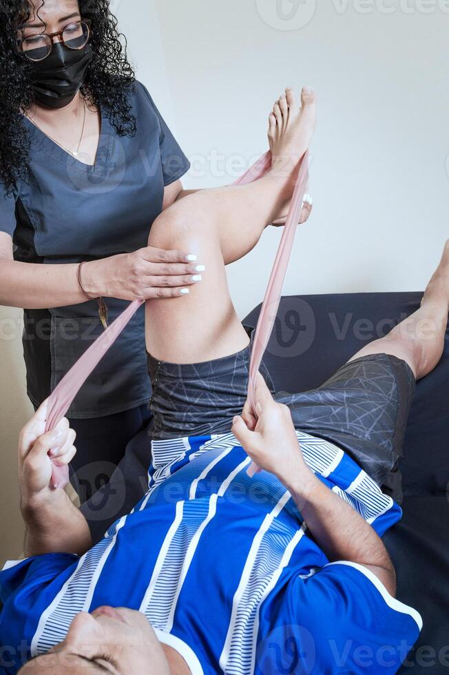 Physiotherapy exercises for knee strengthening, Knee Wrap Physiotherapy, Knee Strengthening Physiotherapy, Neuromuscular Bandage Treatment. photo