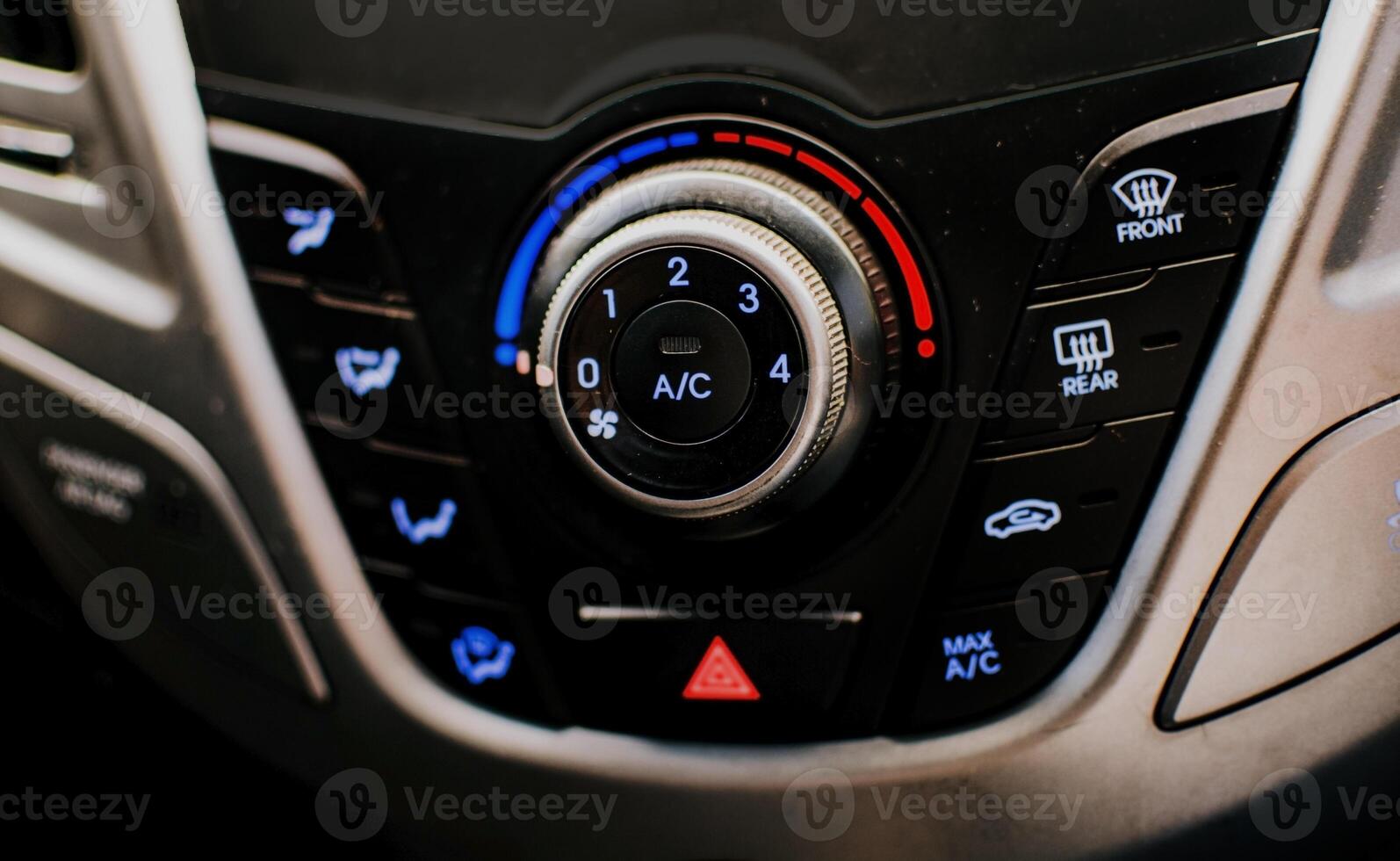 Front view of a car air conditioning control panel. Air conditioning knob of a car. Close up of automotive air conditioning switch panel photo