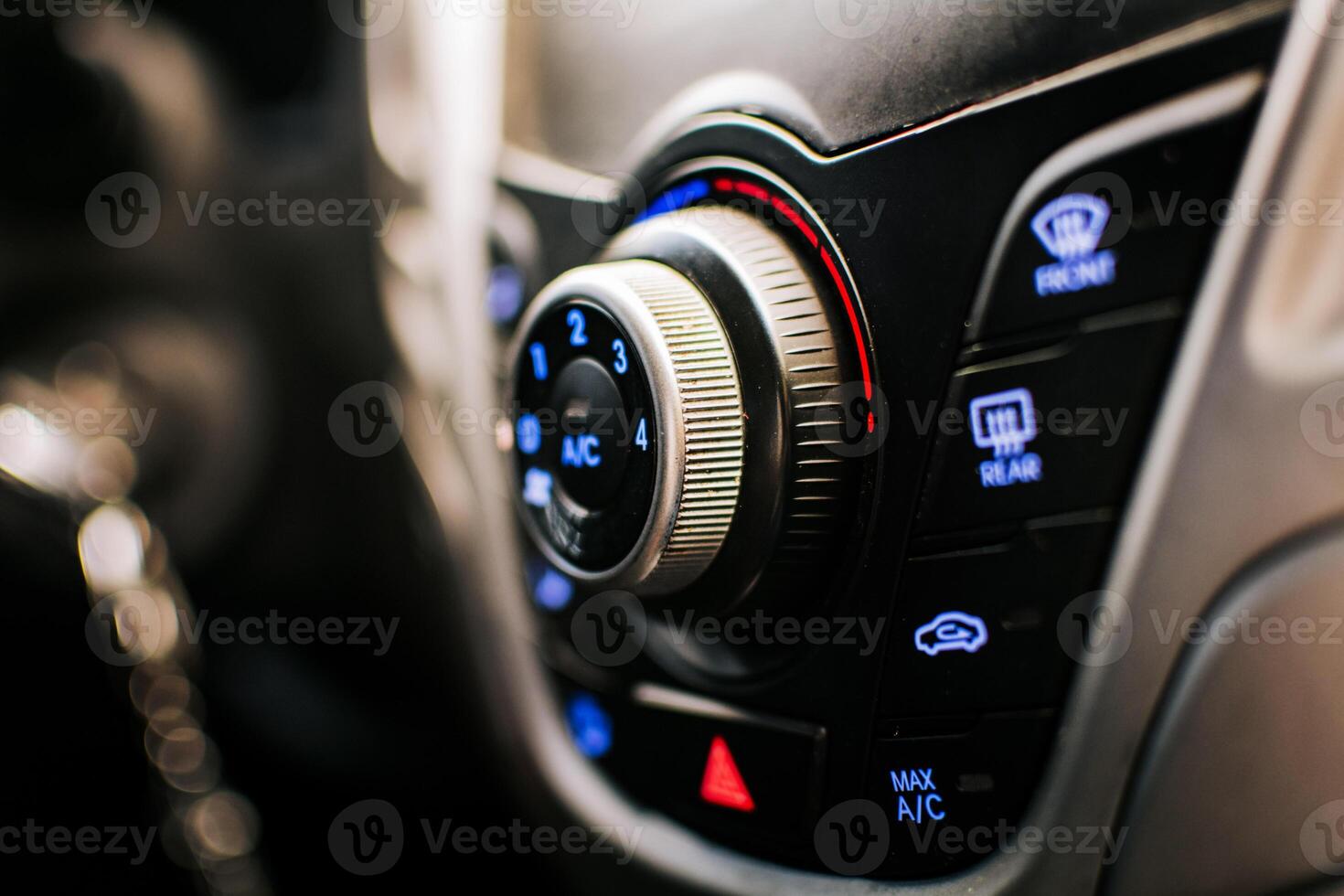 Side view of a car air conditioning control panel. Air conditioning knob of a car. Close up of automotive air conditioning switch panel photo