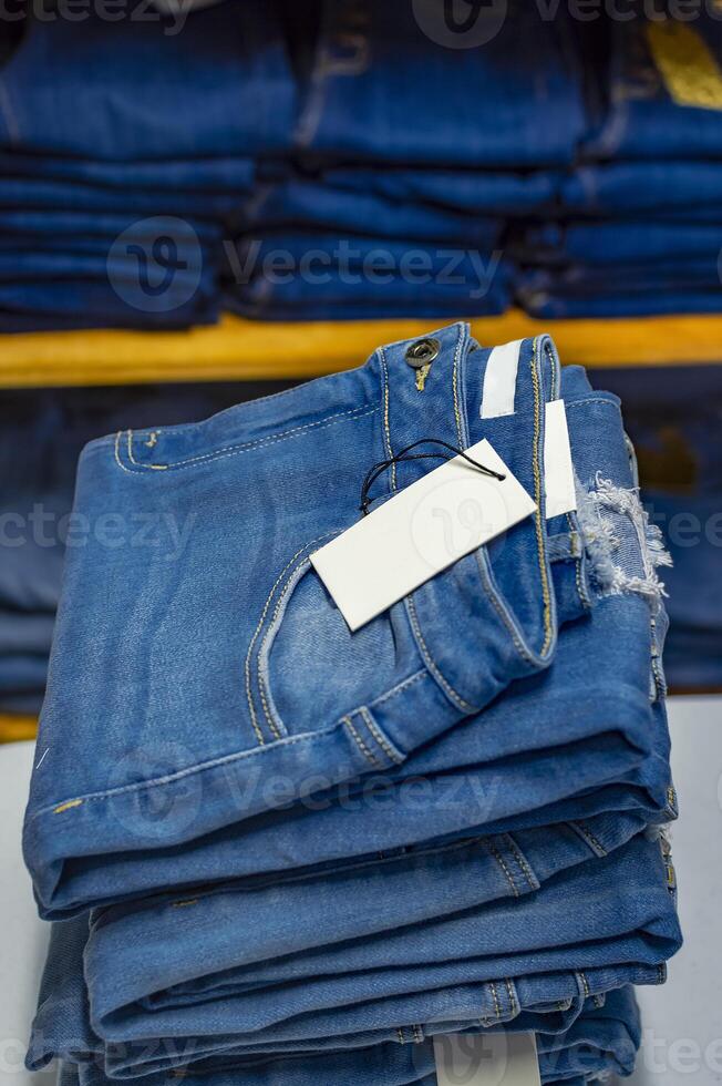 Close up of blue jeans on others with copy space, Various jeans on others with space for text photo