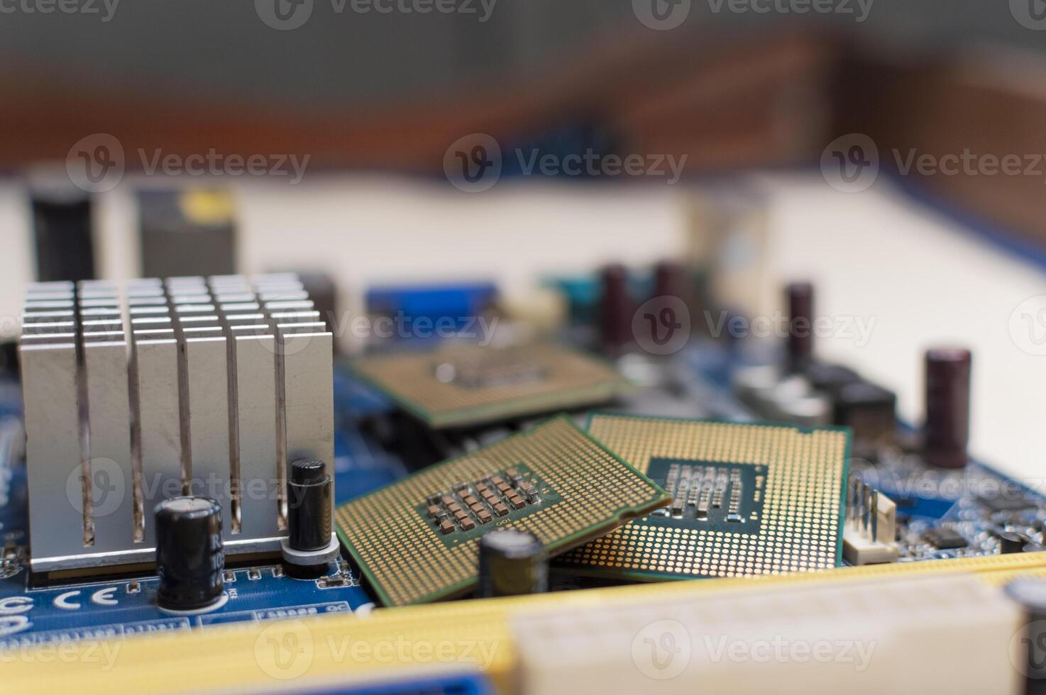 Close up of a motherboard, details of a computer motherboard, detail of a motherboard socket, three processors on a computer motherboard photo