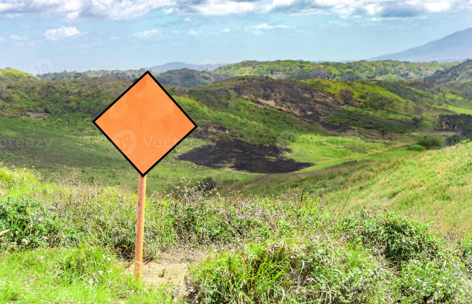 An empty road sign on top of a hill, Empty road sign, blank road signs photo