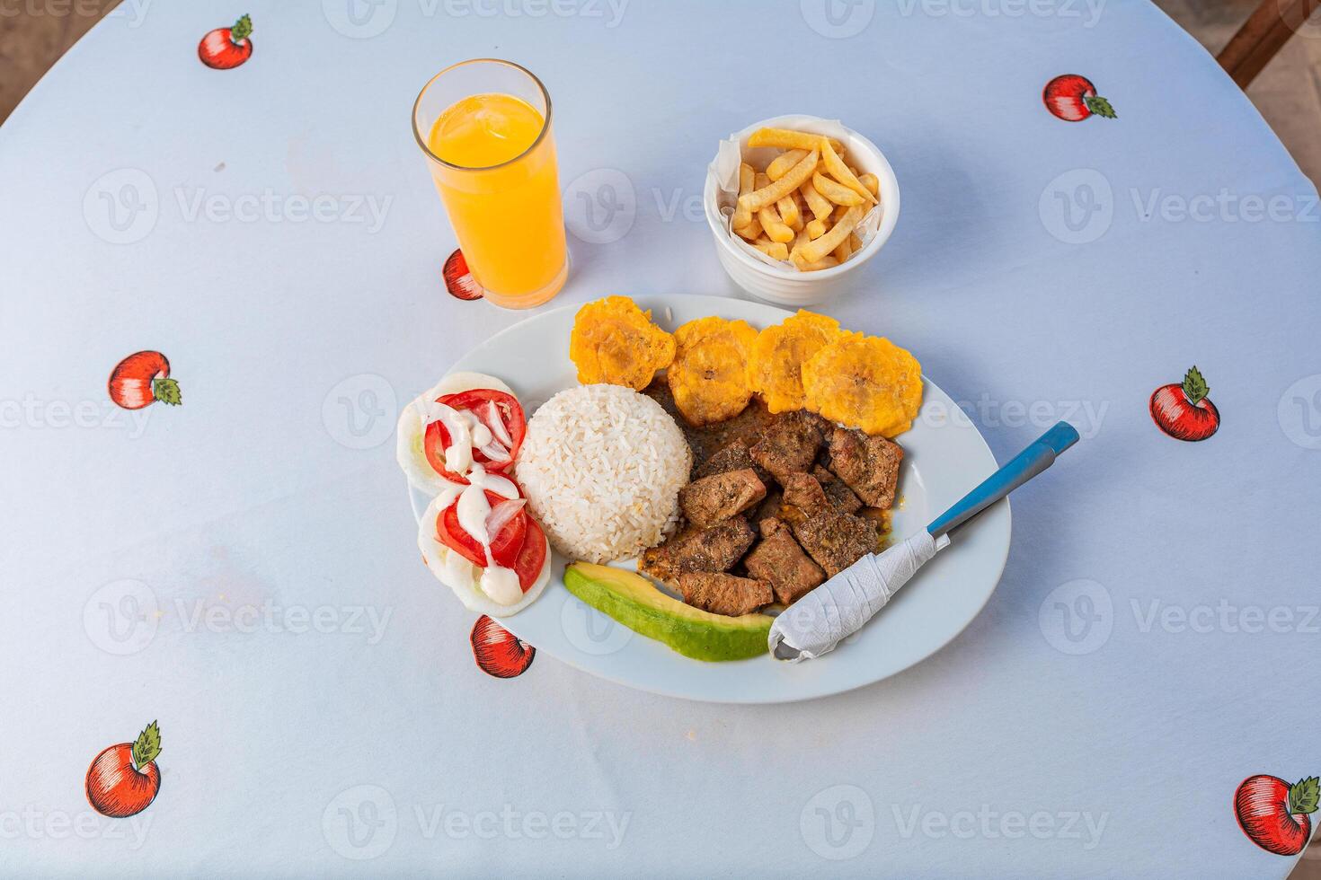 Tradicional lunch served at the table. Top view of traditional lunch with orange juice on the table. photo
