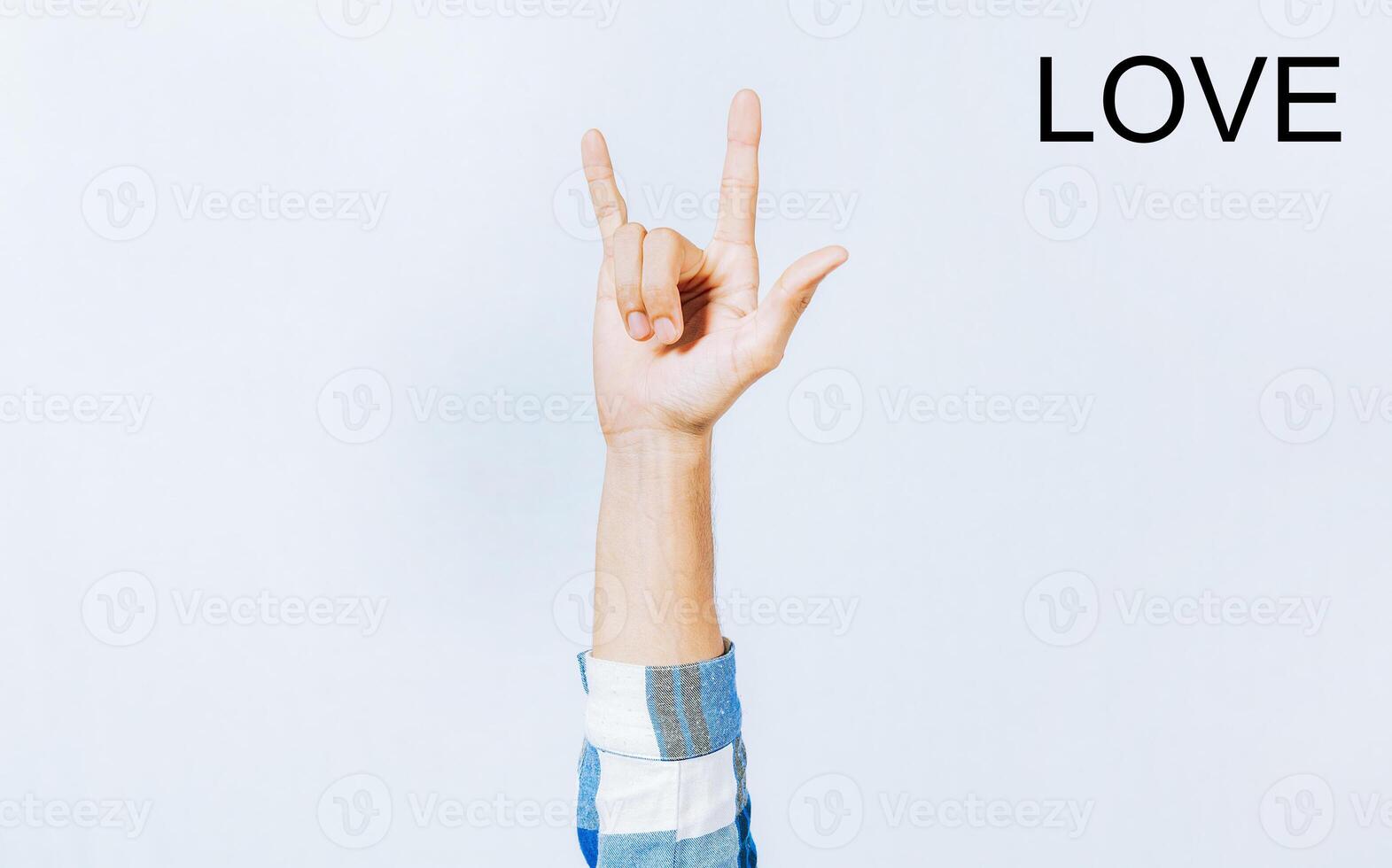 Hand gesturing LOVE in sign language. Hand of man gesturing LOVE in sign language photo