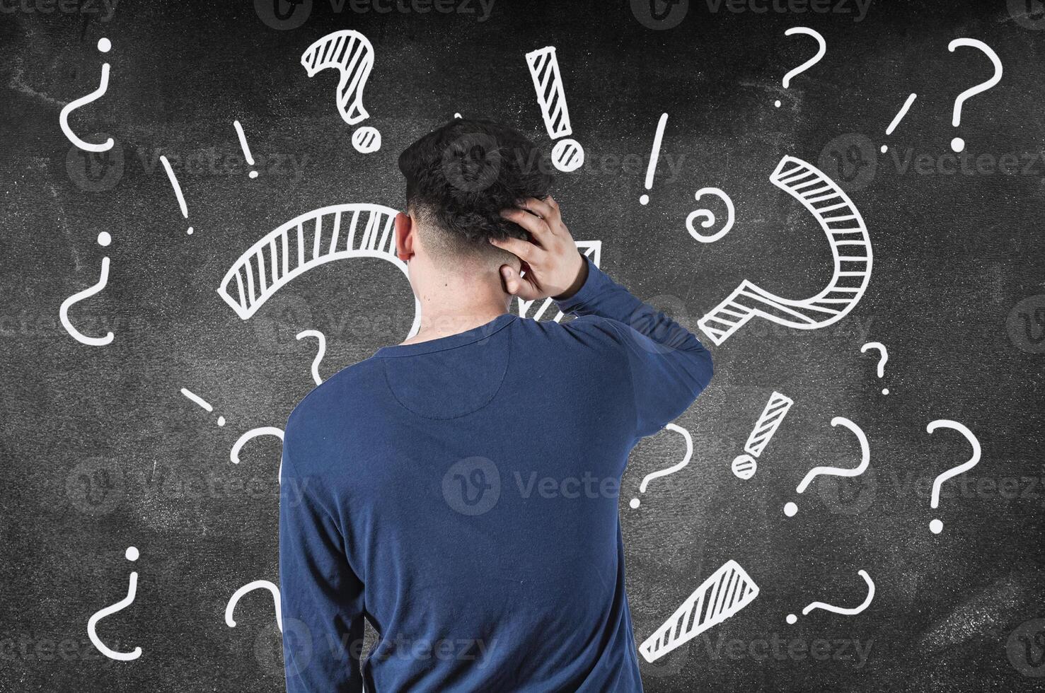 Puzzled man scratching his head isolated. Rear view of confused man scratching head isolated photo
