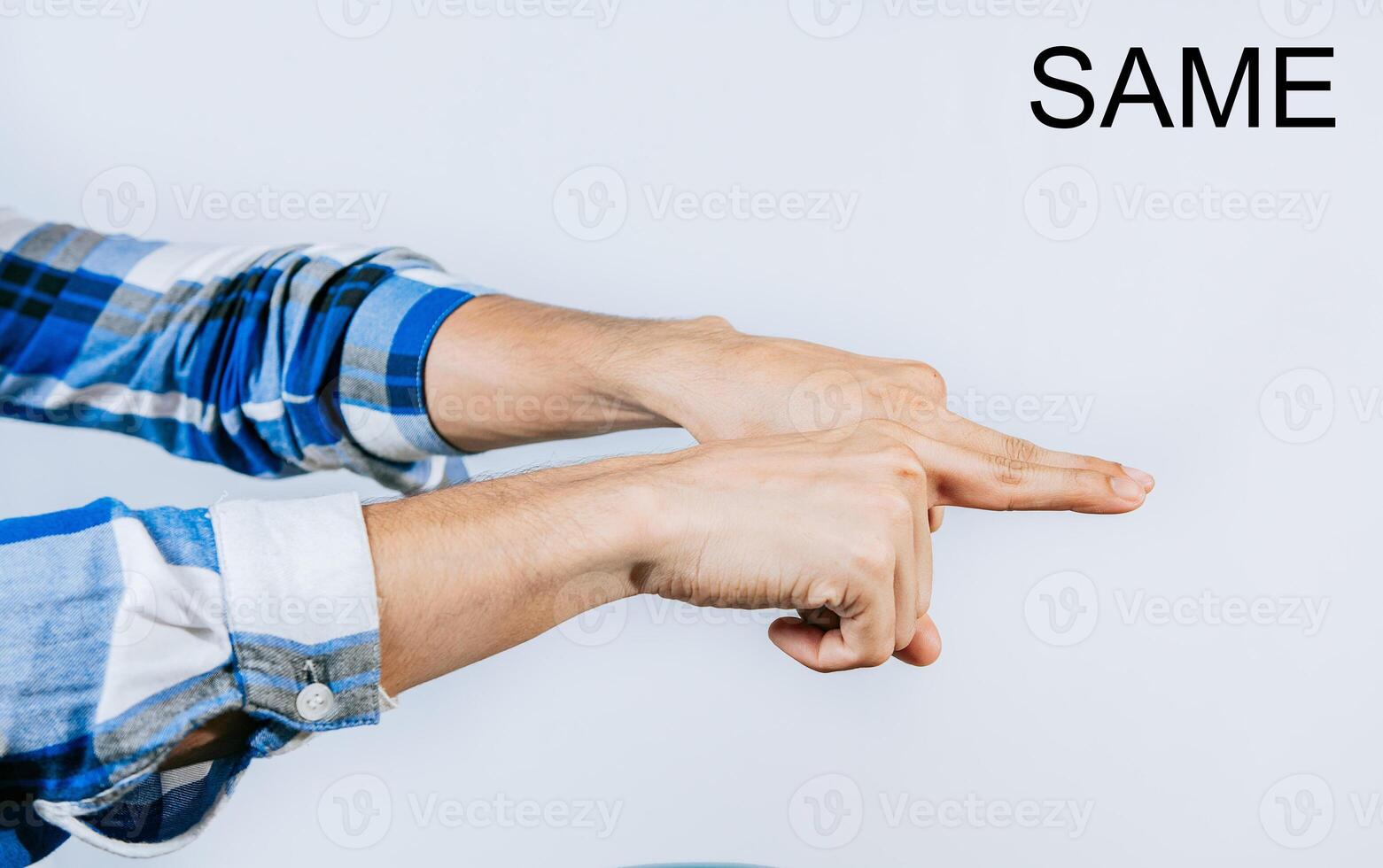 Hand showing word SAME gesture in sign language isolated. Man hand gesturing the word SAME in ASL sign language photo