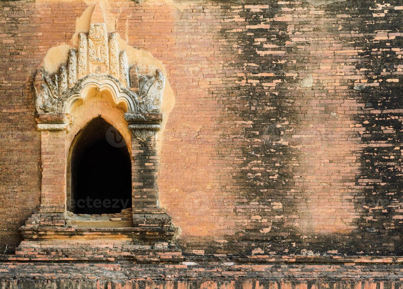 Ancient stucco window in Bagan temple, Myanmar photo
