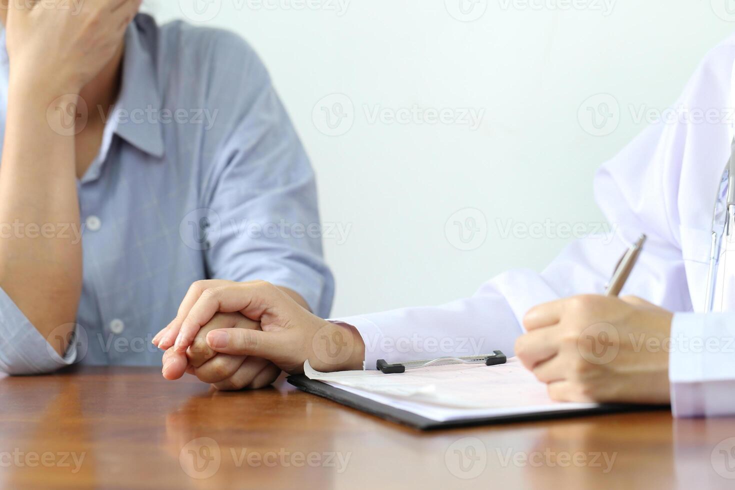 Take care and trust concept, Doctor holding hands of patient at hospital photo