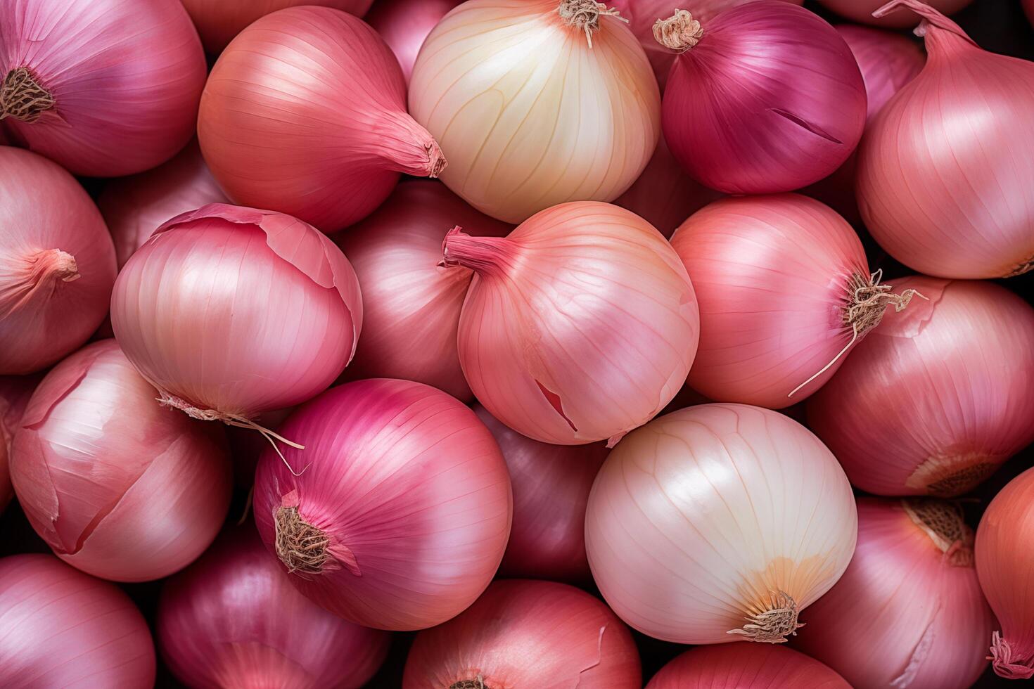A pile of fresh onion form the background, shown from above photo
