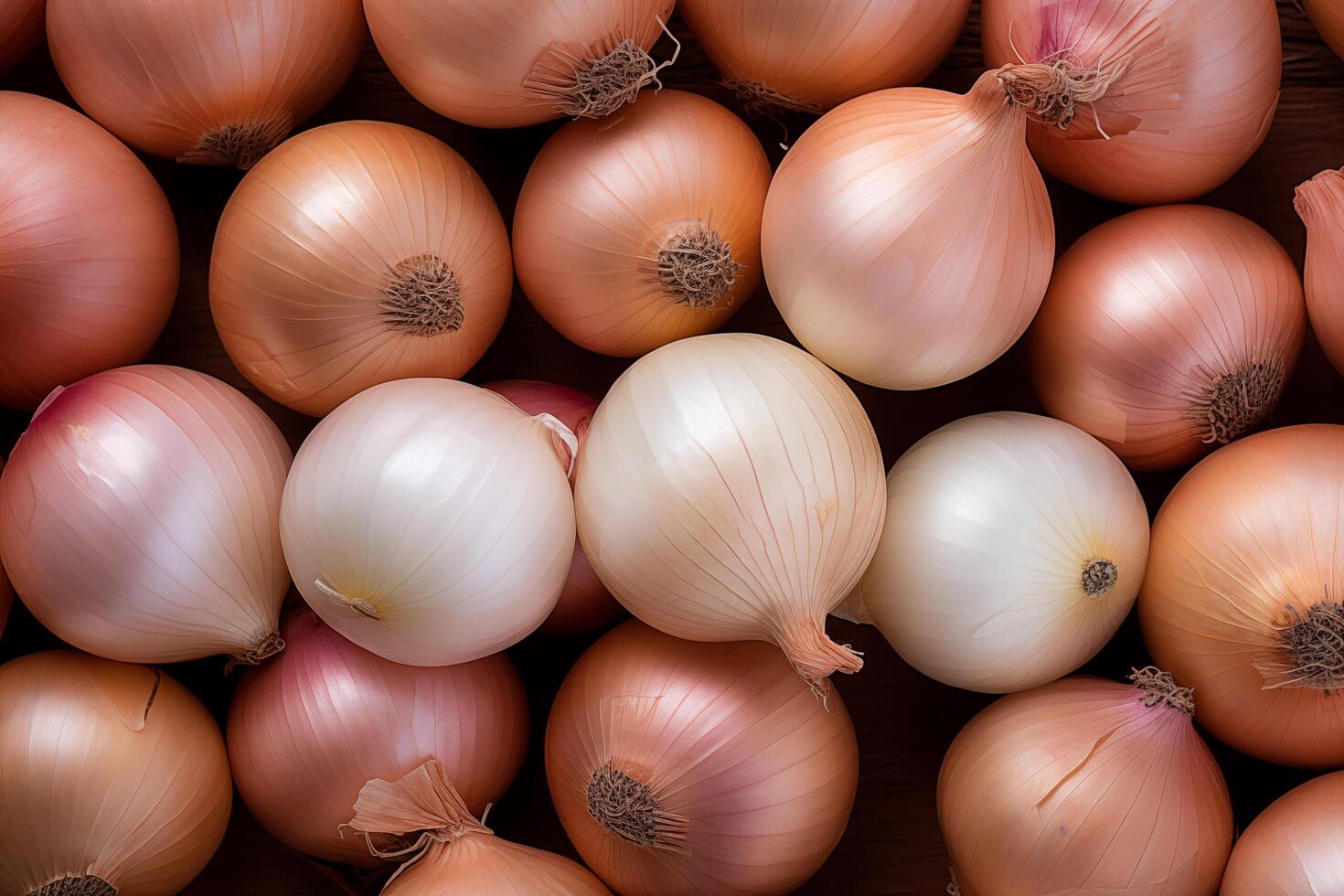 A pile of fresh onion form the background, shown from above photo