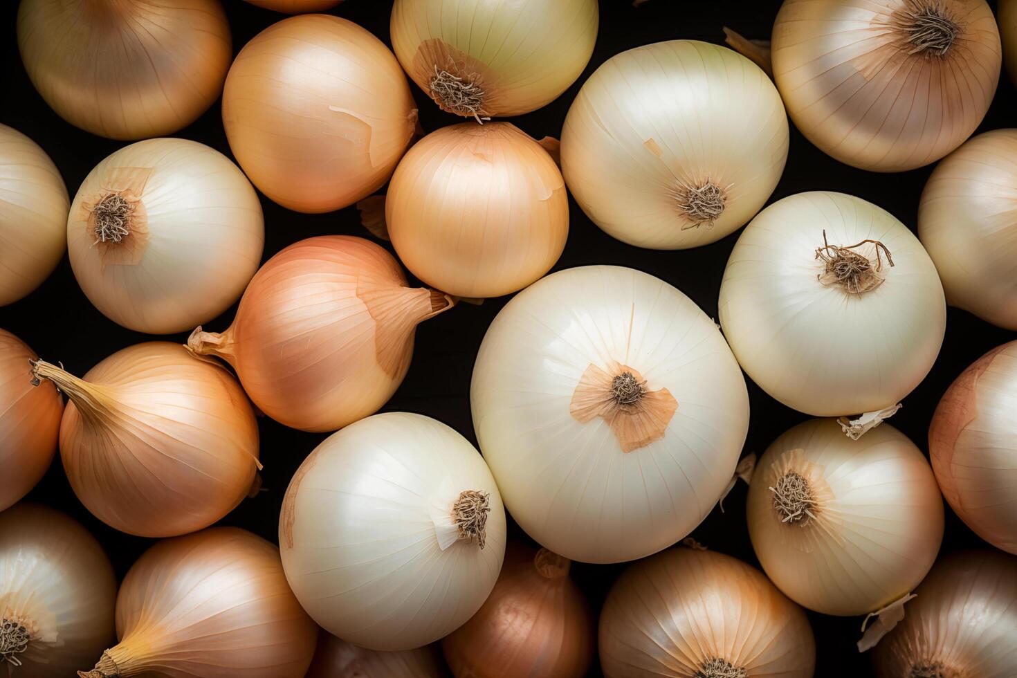 A pile of fresh onion form the background, shown from above photo