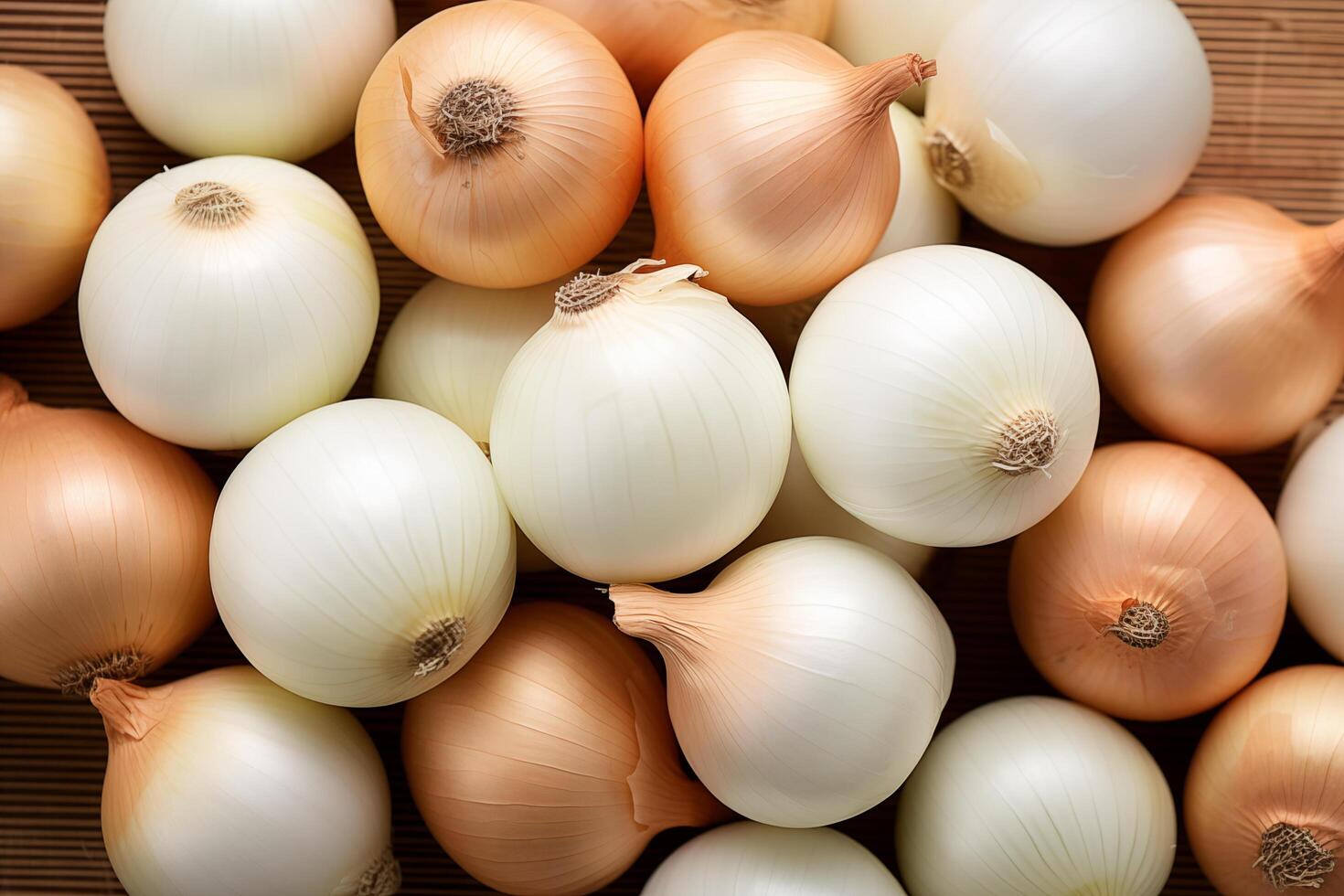 A pile of fresh onion form the background, shown from above photo