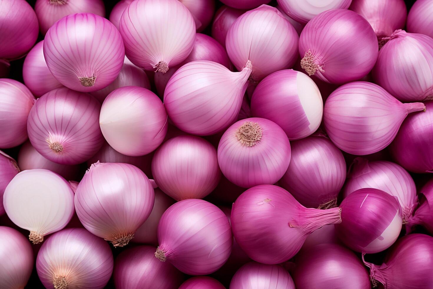 A pile of fresh onion form the background, shown from above photo