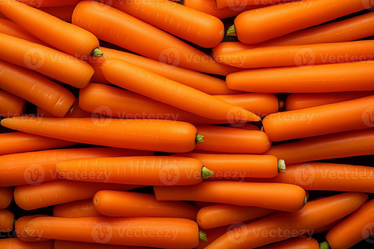 A pile of fresh carrot form the background, shown from above photo