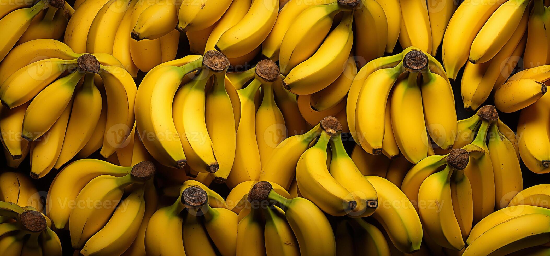 A pile of fresh bananas form the background, shown from above photo