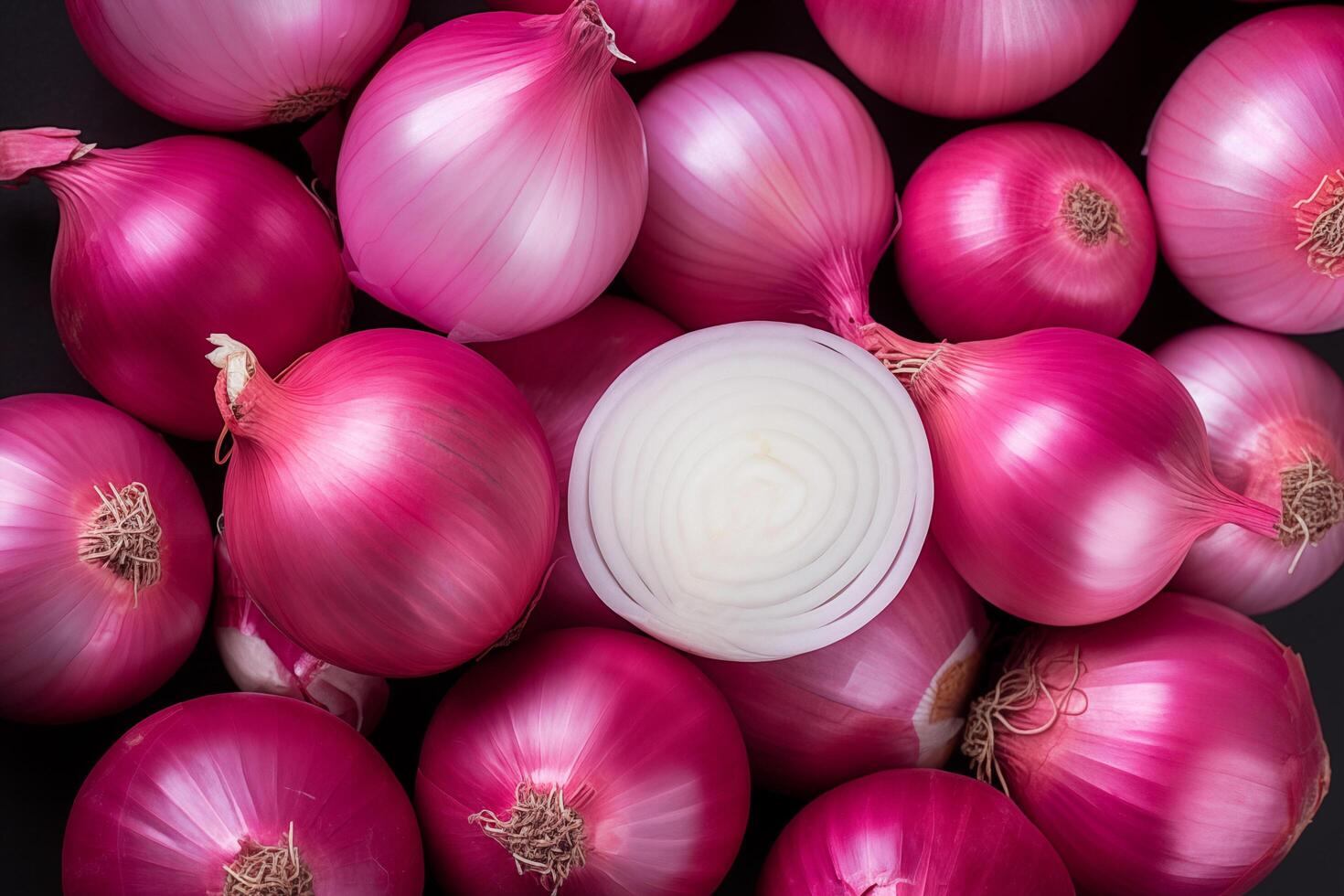 A pile of fresh onion form the background, shown from above photo