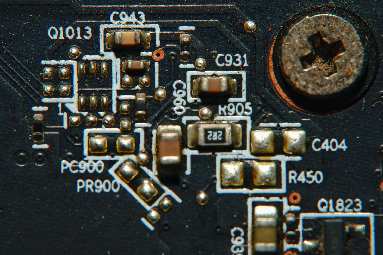close up of a circuit board with many electronic components photo