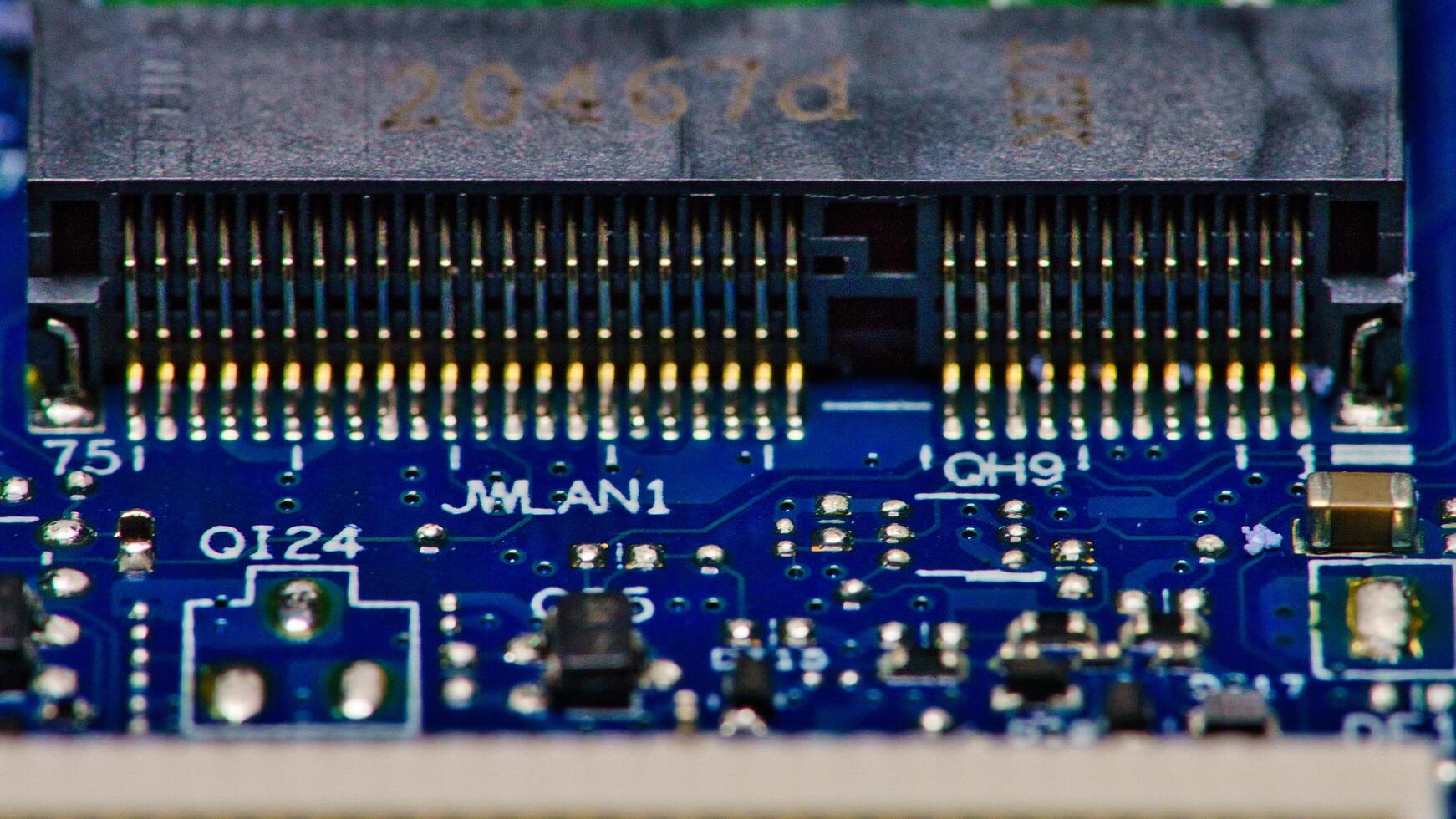 a close up of a computer motherboard with a small chip photo