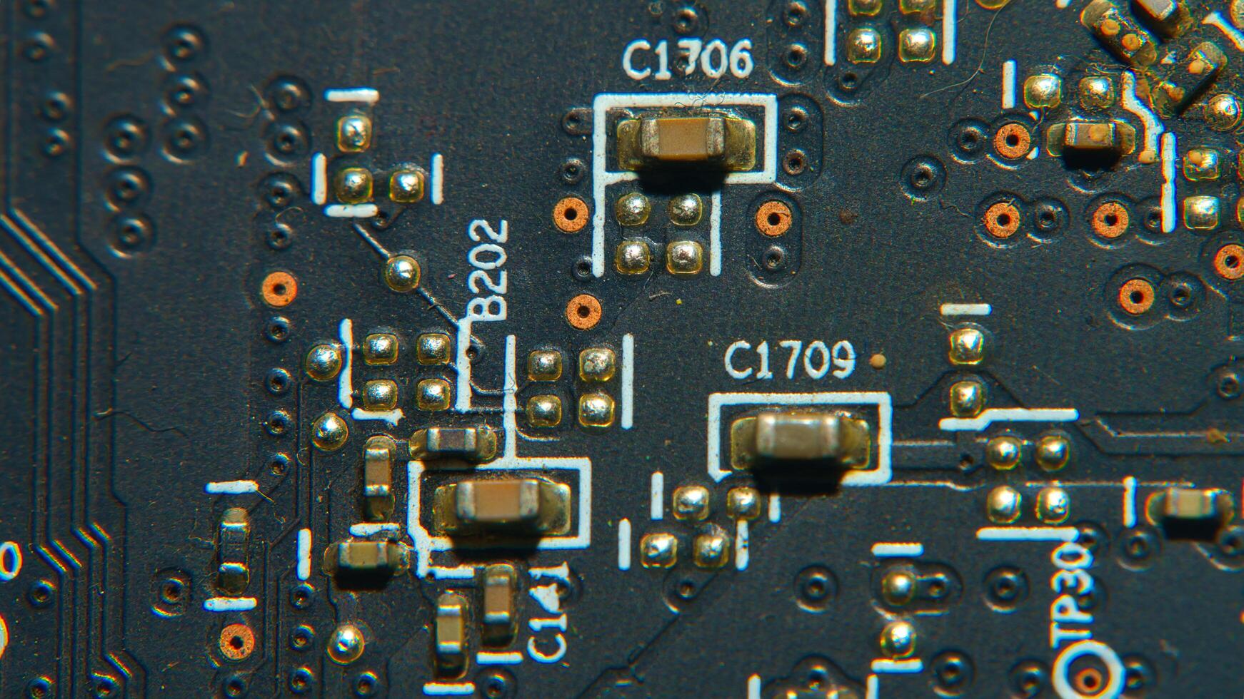 close up of a circuit board with many electronic components photo