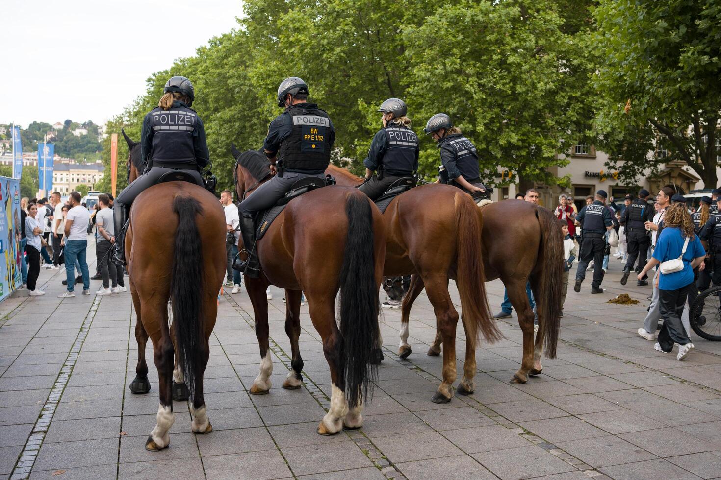Stuttgart, Germany, 5 July 2024. The Stuttgart Mounted Police in Baden-Wuertenberg. Police officers on horseback patrol the street during sporting events. photo
