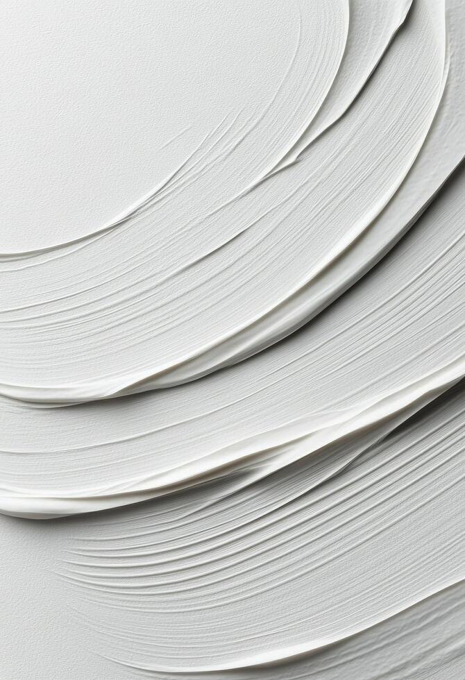 Layers of textured white paint on canvas creating a smooth artistic surface photo