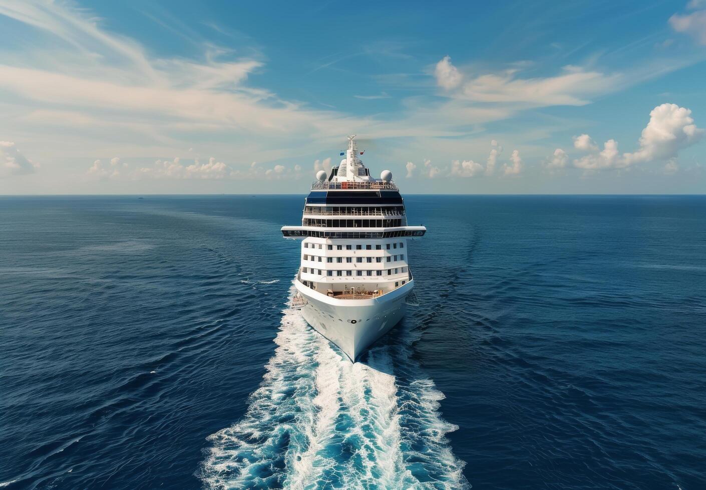 Cruise Ship Navigating Calm Ocean Waters Under Blue Sky and Fluffy Clouds photo