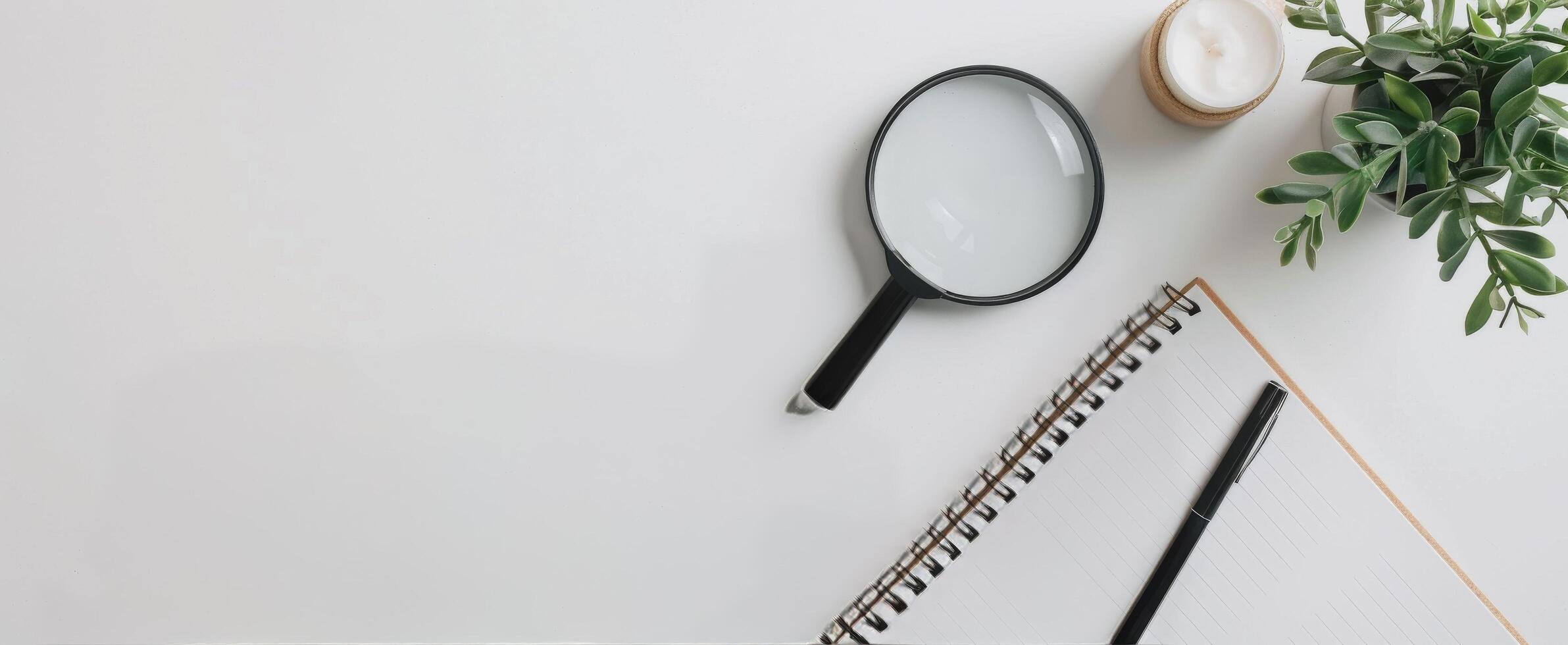 Magnifying Glass on Documents With Pink Pen in Brightly Lit Workspace photo
