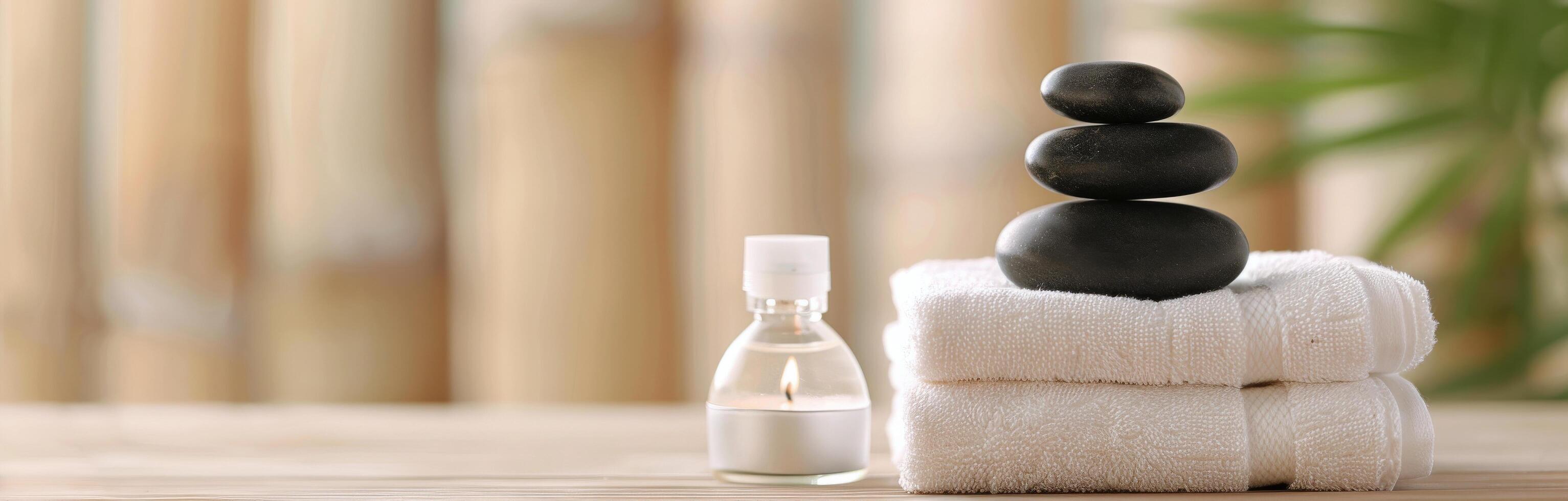 Relaxing Spa Setup With Candles and Stones Beside Soft Towels in a Calm Environment photo