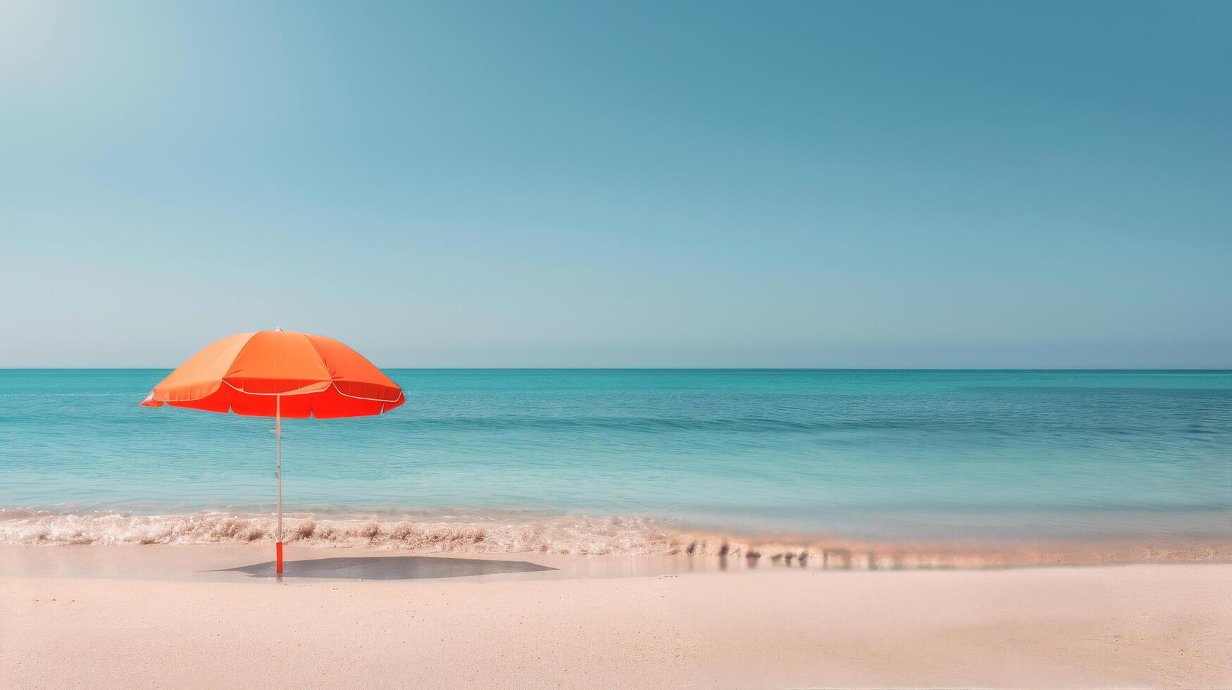 Orange Umbrella on Sandy Beach by the Calm Ocean Under Clear Sky photo