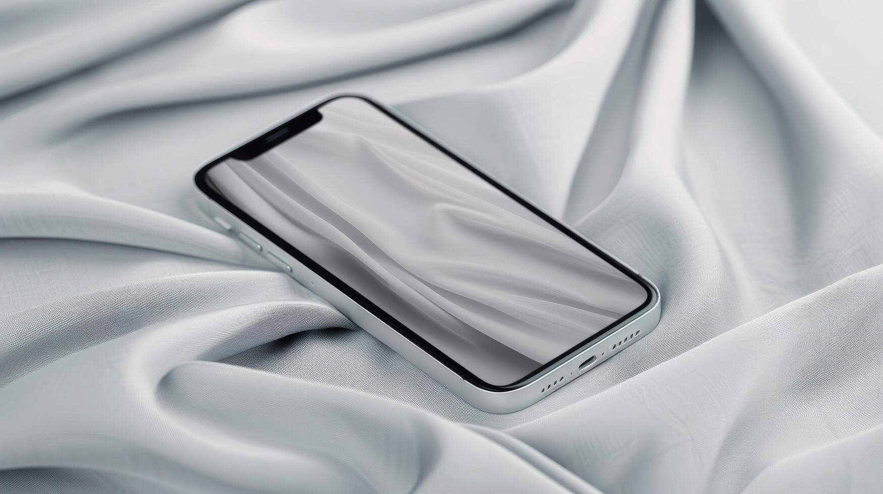 Mobile Phone Resting On Soft White Fabric In A Minimalist Setting photo