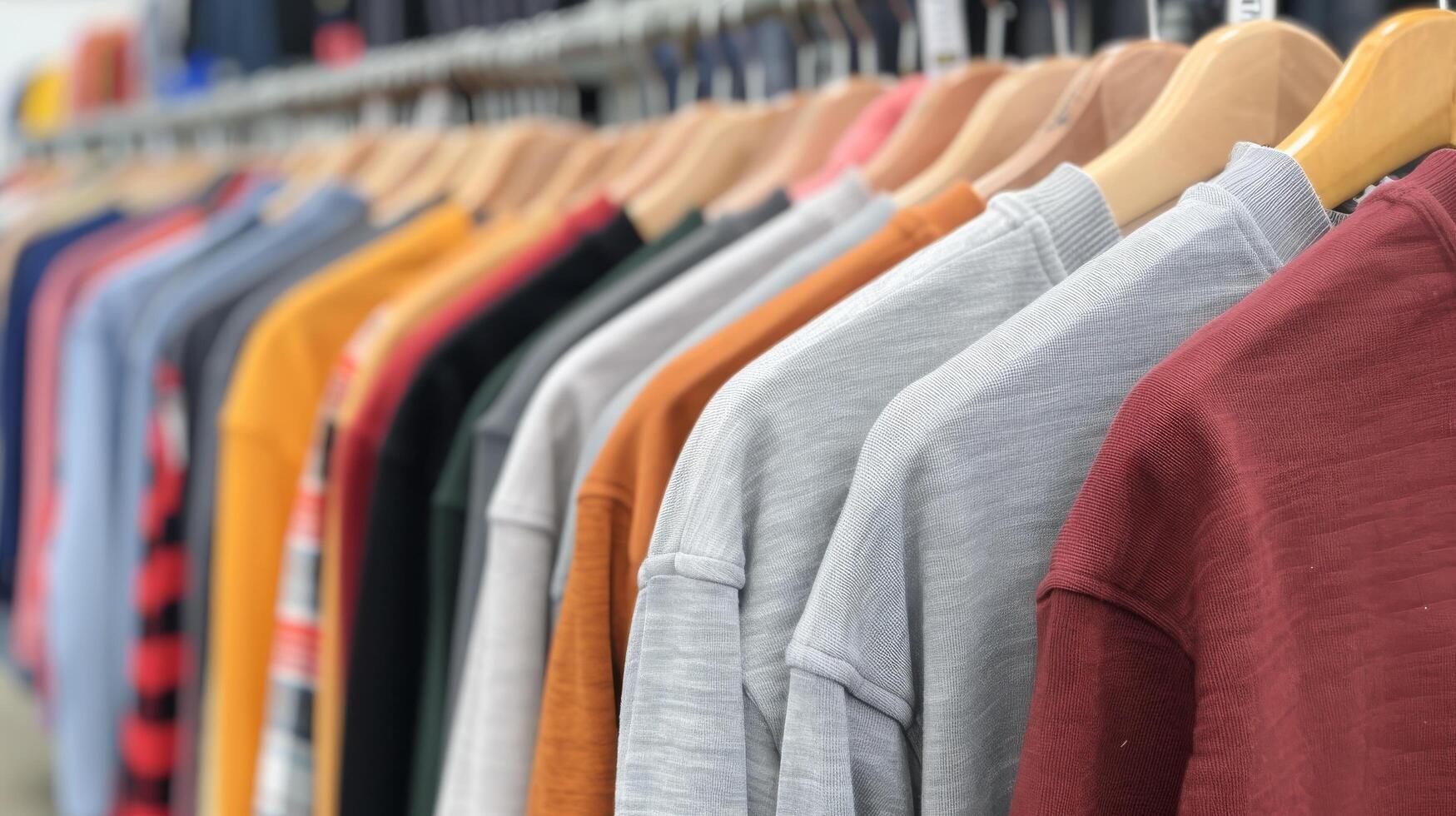 Colorful Shirts Displayed in a Retail Store During Daylight photo