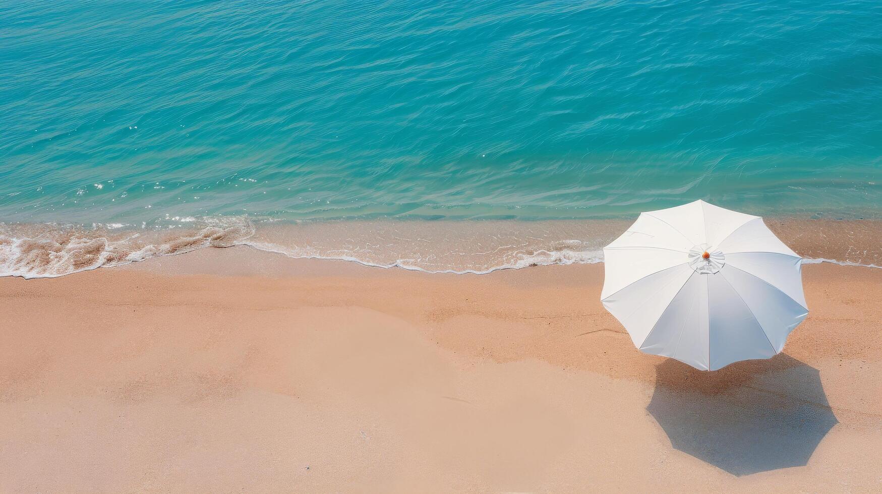 White Umbrella on Sandy Beach With Turquoise Water Under Clear Sky photo