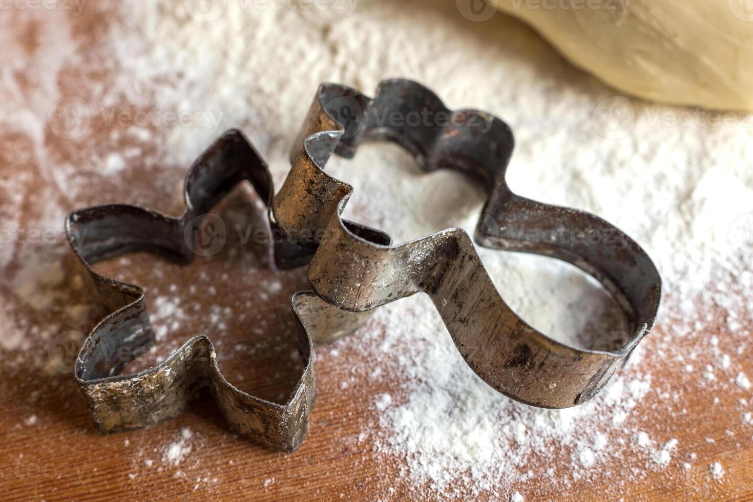 forms for squeezing the dough. dough on the table with dough tools. photo