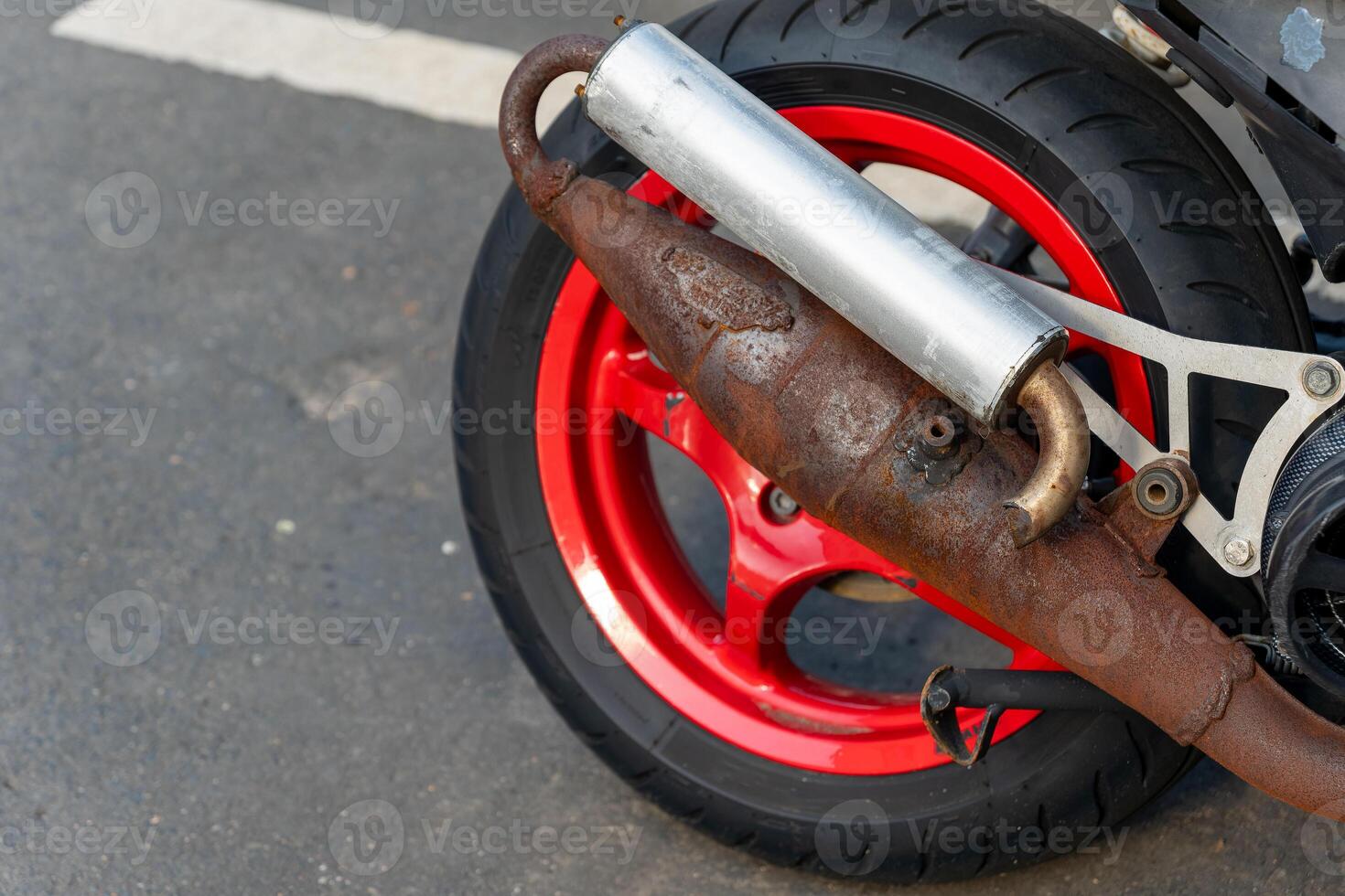 motorcycle with a rusty exhaust pipe photo
