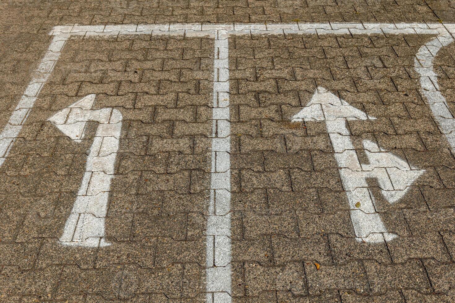parking lot with two arrows pointing in opposite directions photo