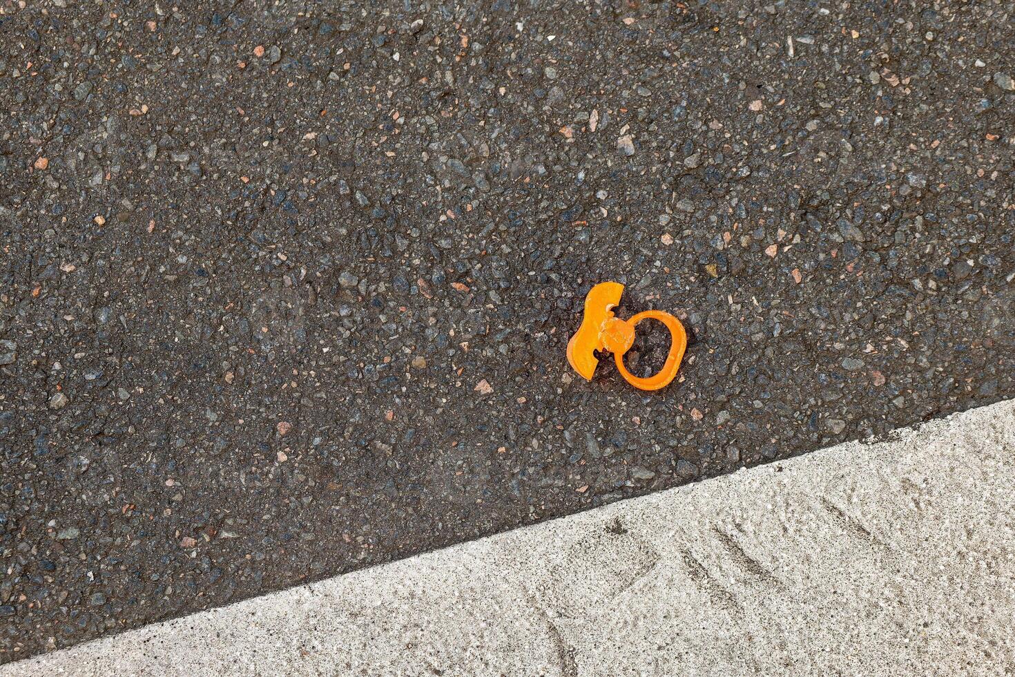 an old baby pacifier on the street photo