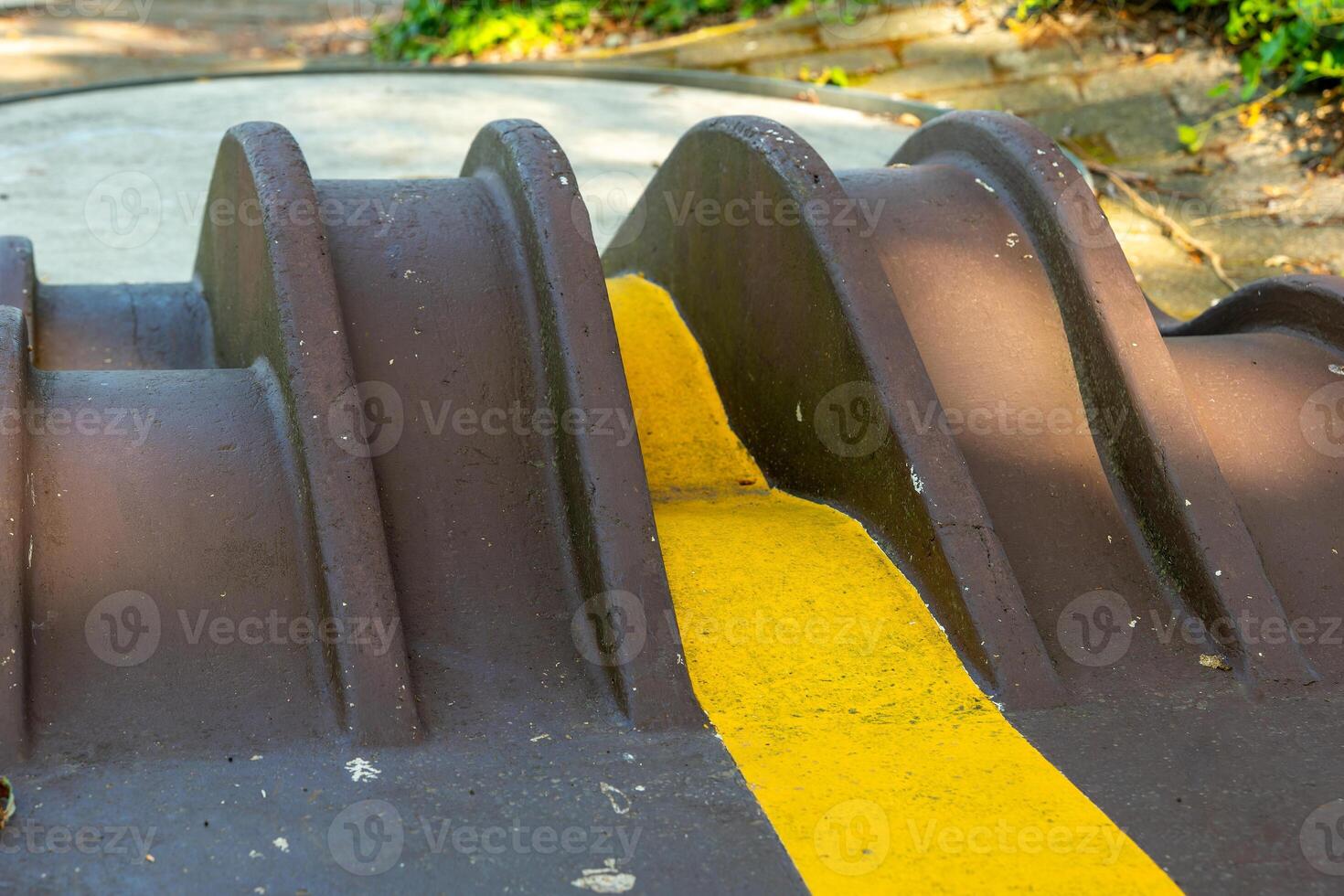 yellow line is painted on a concrete ramp photo